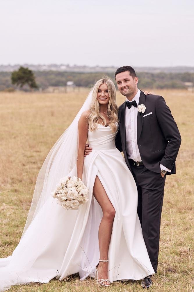 The iconic Mariana Hardwick Chantelle bridal gown, Chantelle's wedding dress, the Chantelle gown, featured a full, billowing skirt with dramatic train, and elegantly draped fabric with accentuated peaks at the neckline.
