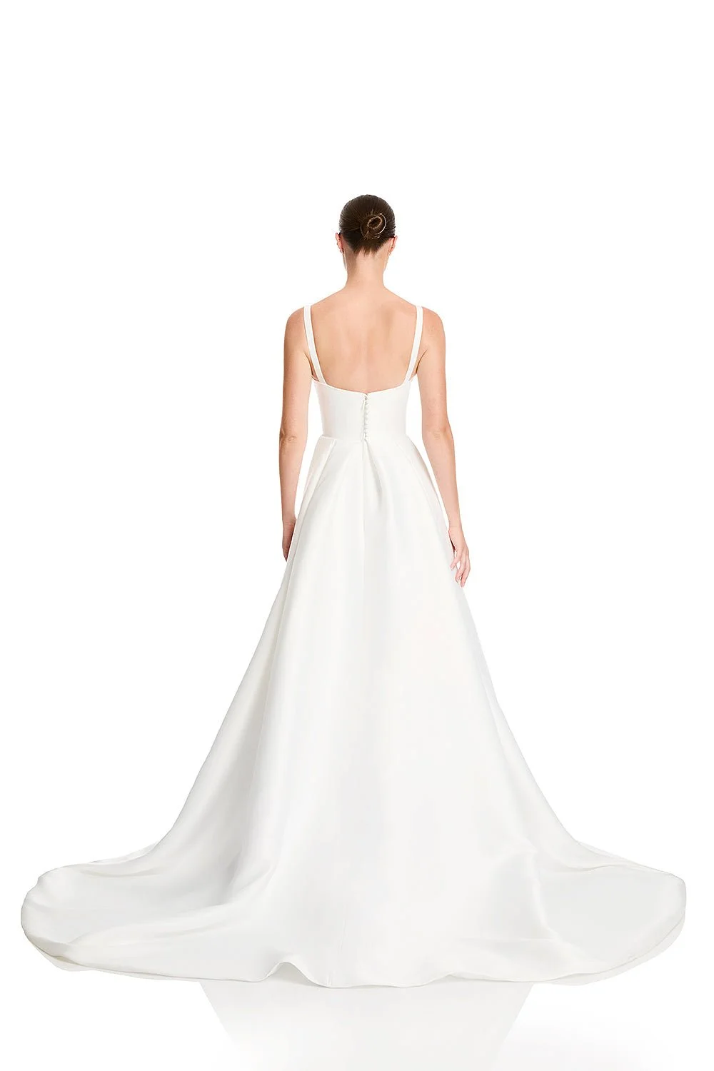 Set the dial to high drama when KYHA Bride Luni enters the room. Maximalism made for minimalists, Luni combines a structured, scoop neck bodice with swathes of luminous duchess satin in a full skirt. Add a split to keep things fresh, and suddenly you