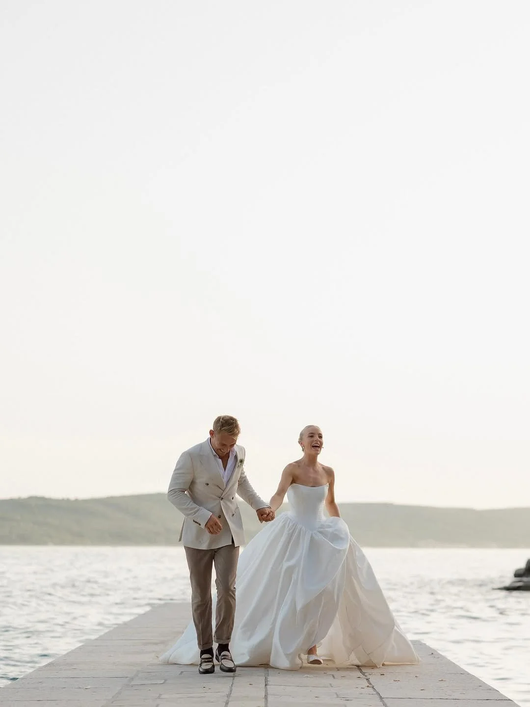 Dress like the queen that you are c/o KYHA Bride Miles. Crafted from a luxe woven taffeta, a gathered Basque waistline accentuates an hourglass shape made modern via a softly scooped neckline. Drama reigns supreme via the ballgown skirt, making Miles