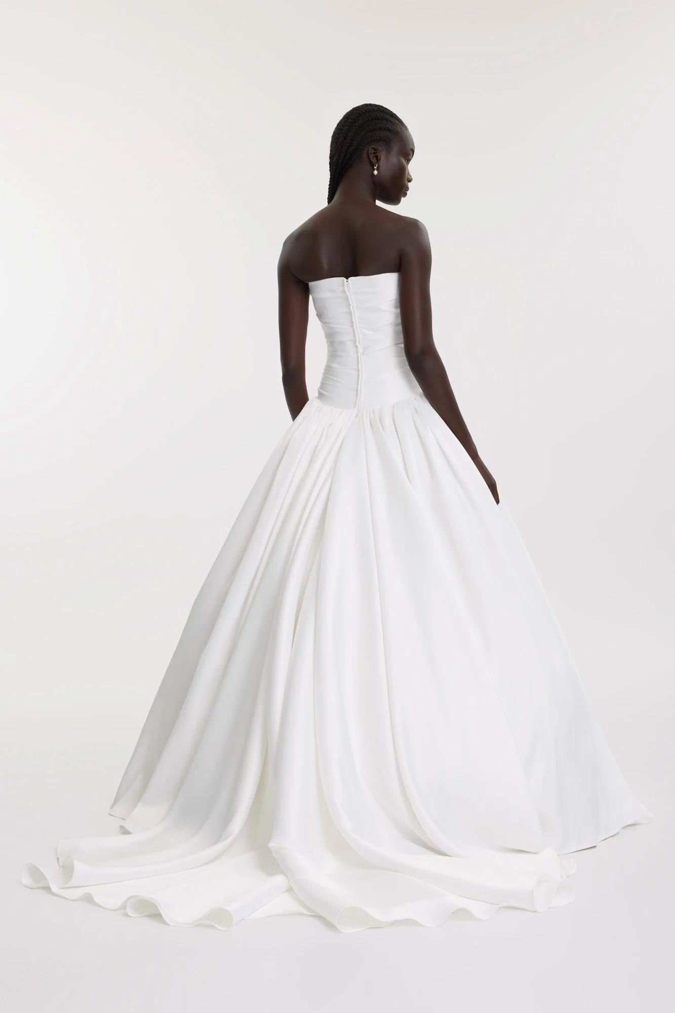 Turn up the volume - and turn heads - in KYHA BrideLucky.  Modern couture meets eighties details thanks to Lucky’s structured, draped drop waist bodice and gathered, full skirt. Crafted from luxe duchess, Lucky is a sartorial showstopper.