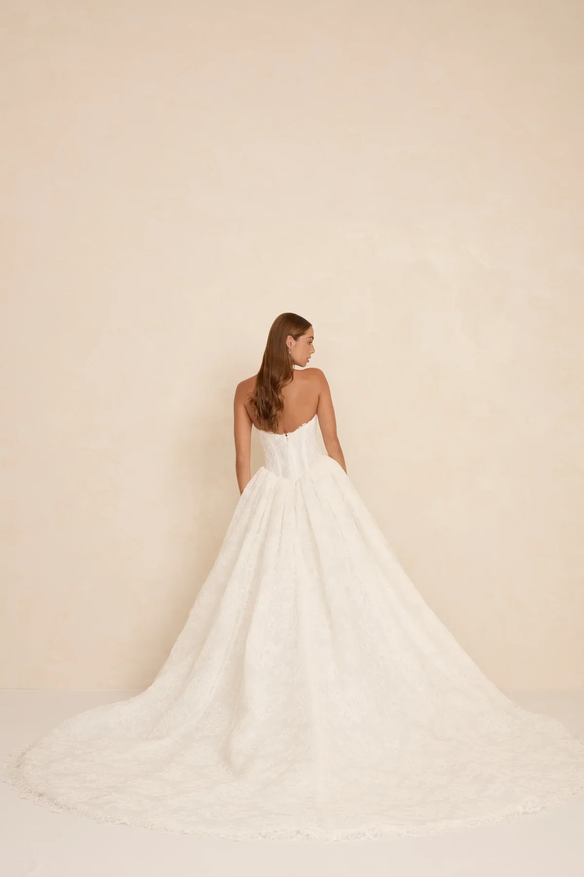 The MWL Rue is a modern bridal masterpiece in delicate Chantilly lace with matching trim at the neckline. Structured boning and a sweetheart neckline create a sculpted, feminine silhouette. Available at Halo & Wren Bridal mid June 2026.