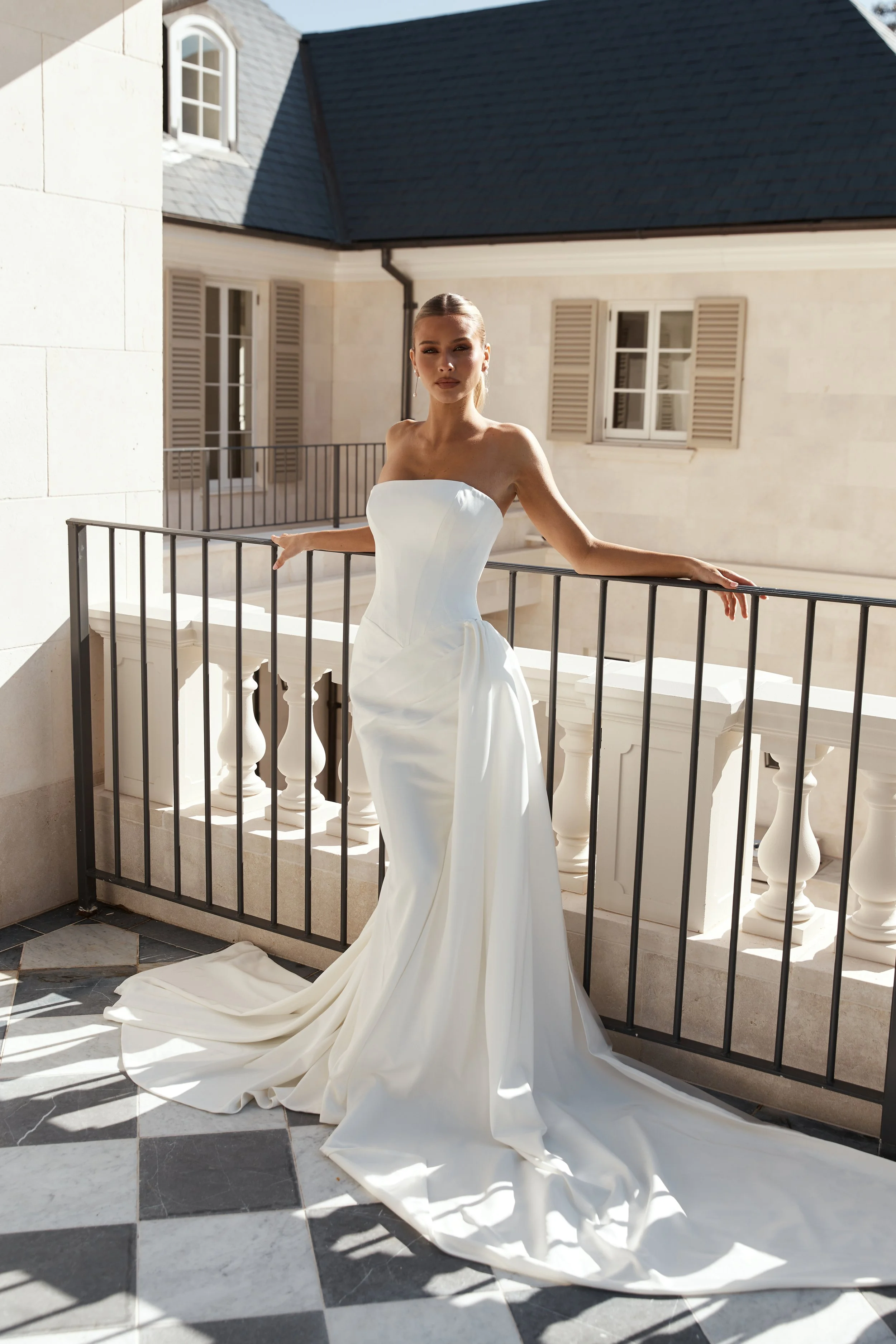 Jane Hill Bridal Slate; Modern, sculpted and effortlessly refined, Slate is a contemporary take on classic corsetry. The straight neckline and exposed seam detailing highlight the structured bodice, flowing into a basque waist that shapes and elongat