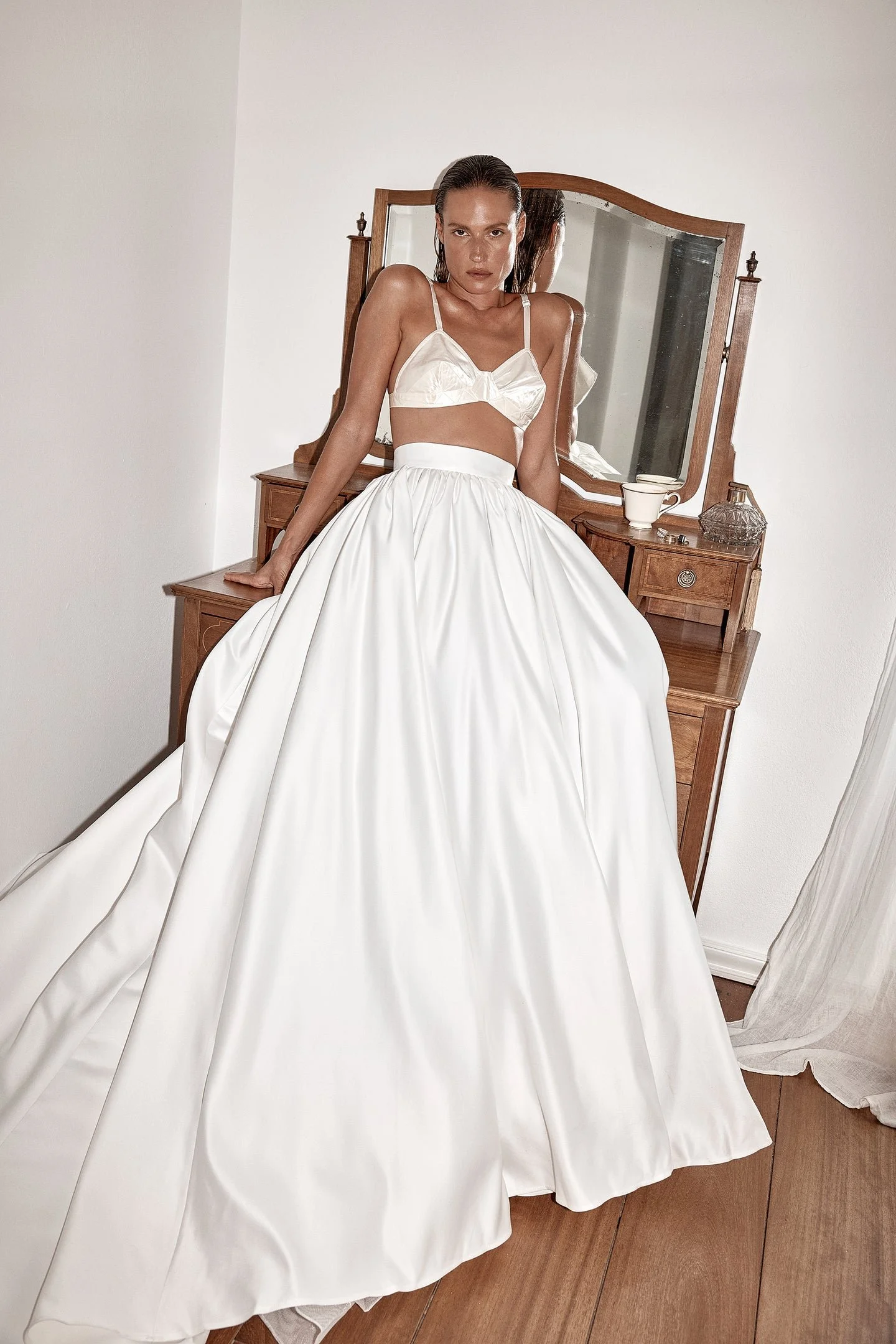 The way to win bridal style is in two parts, first via Vara. Spirit of the 70s captured via its scarf-detailed hem, Vara is a structured corset crafted from luxe duchess satin. Cut for a close fit, Vara features a modern straight neckline and soft or