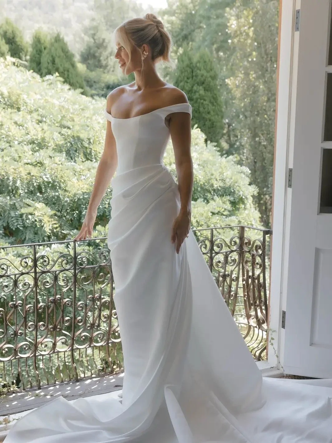 KYHA Bride Winton Gown is a modern bridal statement defined by clean lines and confident structure. featuring a sleek silhouette that skims the body, the Winton balances minimalist design with considered detailing for a refined, fashion-forward look.