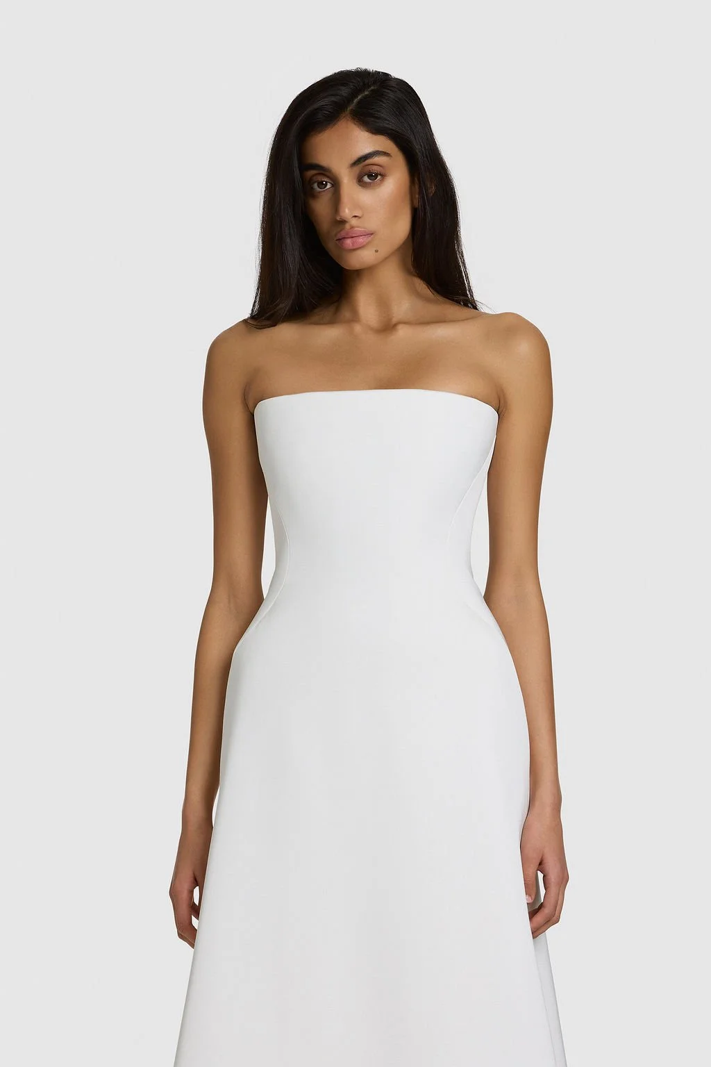 A work of art in KYHA Bride Walkley. Cut from fluid triacetate with a hint of stretch, Walkley’s A-line silhouette features a corseted bodice and liquid-like skirt that gracefully trails behind. The architectural hip detail combining sculptural shapi