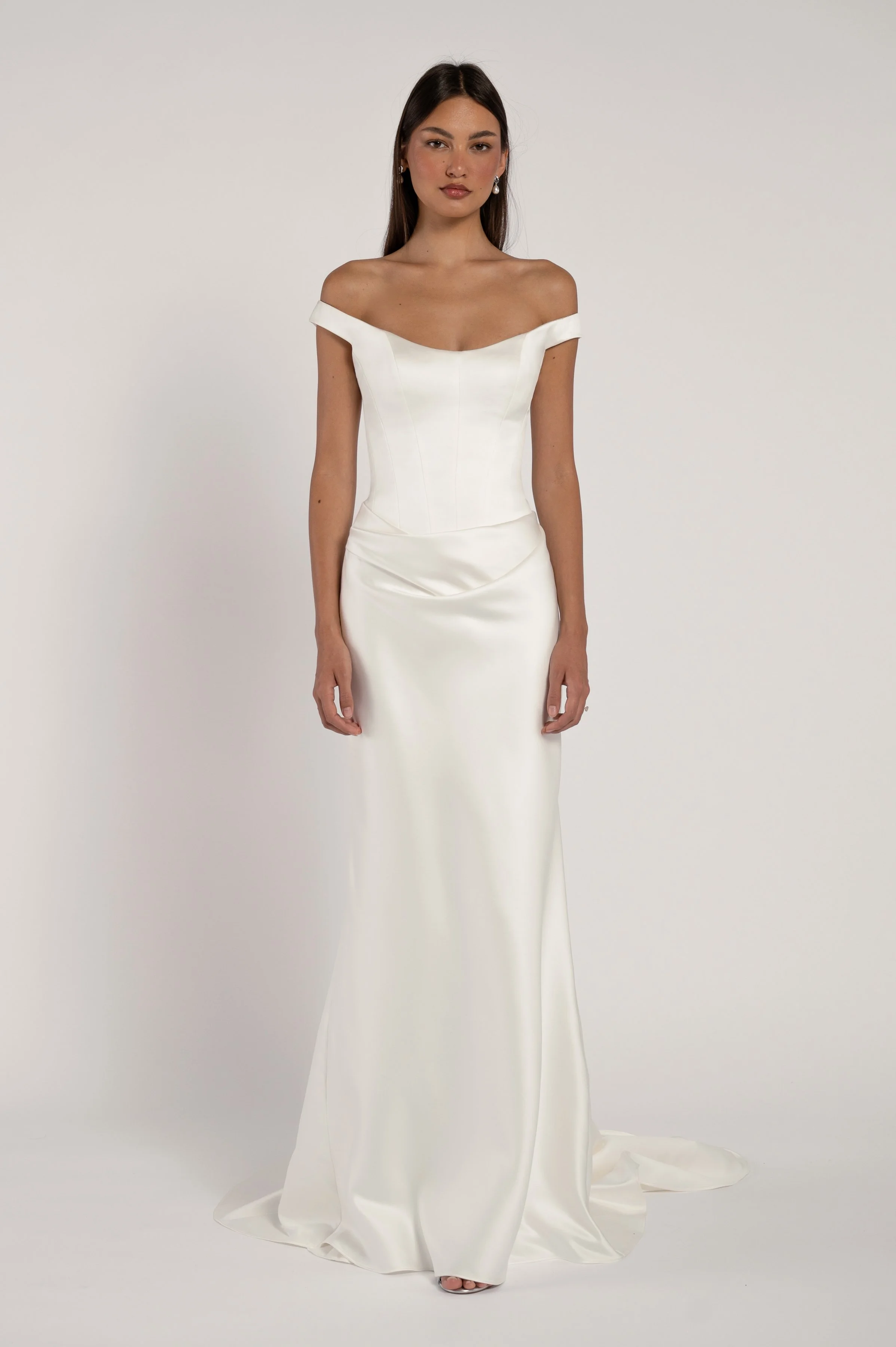 The Elisa gown takes vintage inspiration and molds it into a totally modern silhouette. Corseted structure meets draped softness for a look that is sultry yet romantic.