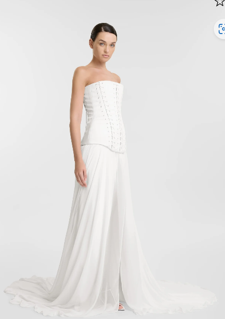 The sheer power of KYHA Bride Bassett. Ethereal yet grounded in strength, Bassett is crafted from light layers of chiffon to see you float through your big day. Featuring a statement split, pair Bassett with the Ford corset for the ultimate in dichot