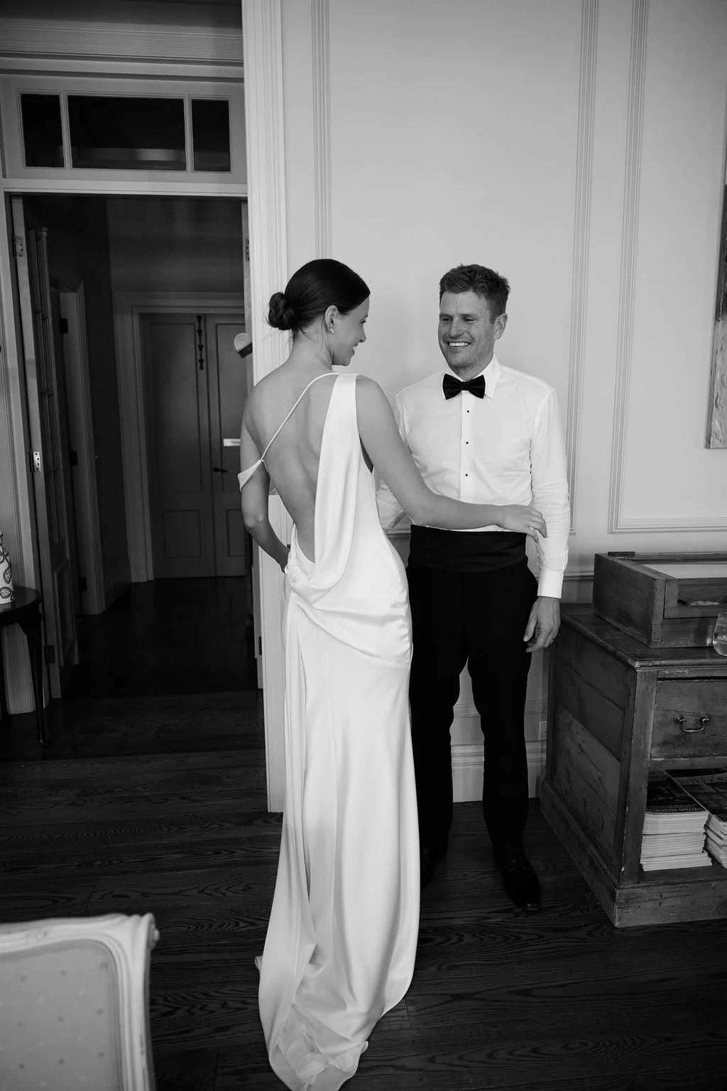 Effortlessness takes the lead in KYHA Bride Arlo. Cut on the bias, liquid double satin falls naturally over the body, delivering nonchalant energy with a distinctly modern edge. A clean, minimal off-shoulder front allows the open back to take centre 