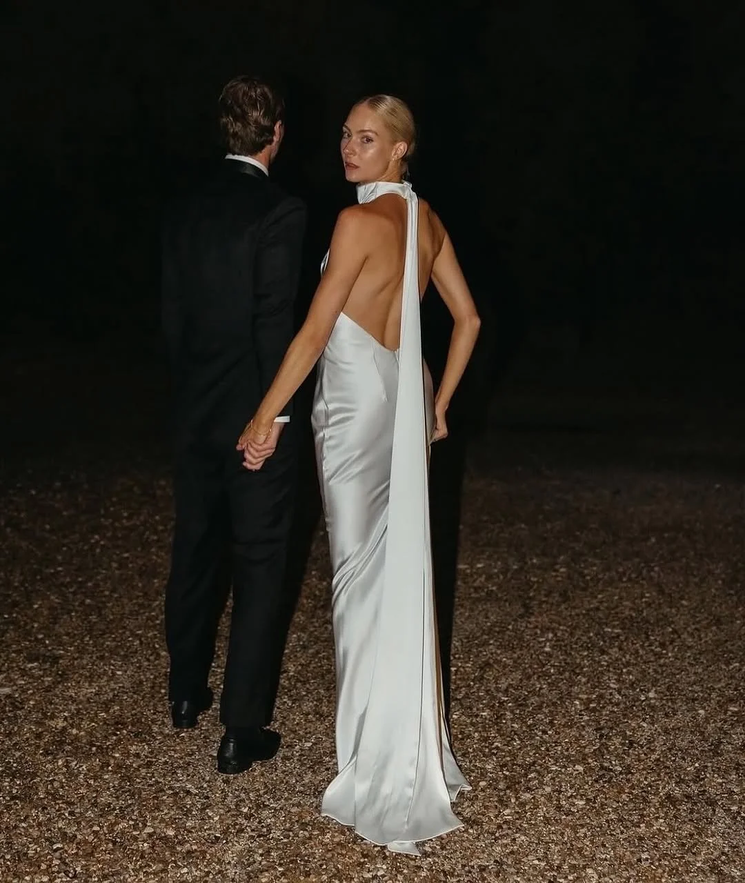 For minimalism with main character energy meet KYHA Bride Cameron. Fluid draping from the halter neck falls effortlessly into a relaxed silhouette. Crafted from satin triacetate, Cameron’s showstopping low back is celebrated via its long ties at the 