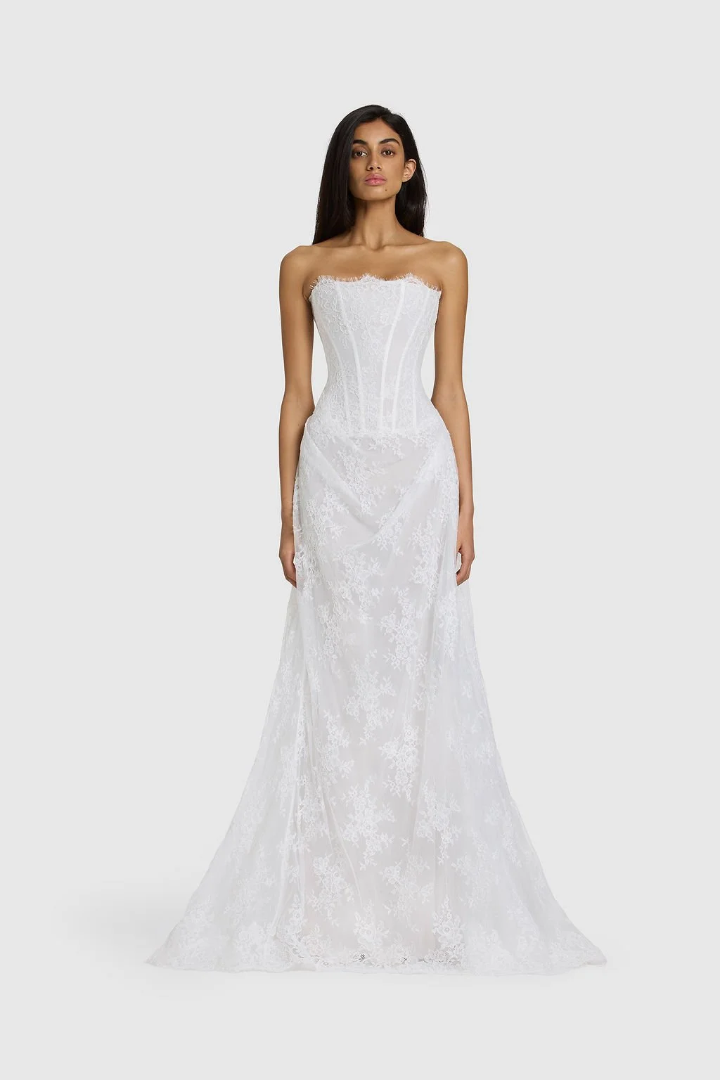 Quiet drama reimagined in KYHA Bride Mimi. Lace without the noise, Mimi's silhouette is deliberately spare. A structured, strapless corset sees sheer lace panels layer over chiffon, casting soft contrast against warm shell for a fresh yet understated