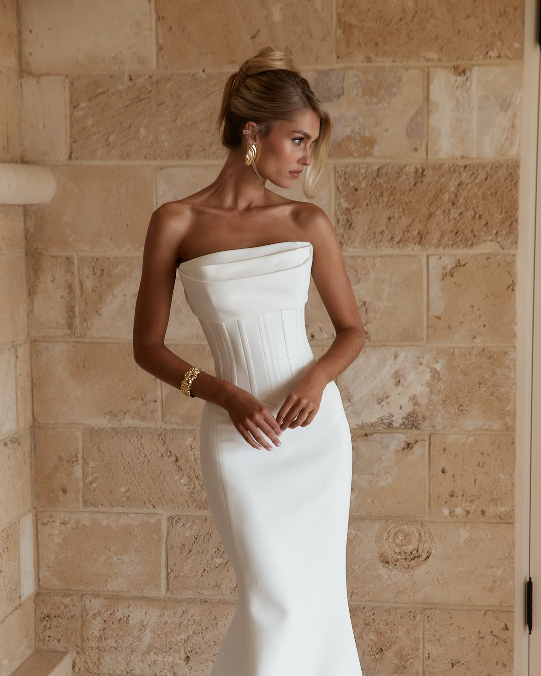 Jane Hill Bridal Benni sculpted for the modern bride, Benni features our signature fit-and-flare silhouette with a slight drop waist and a flattering straight neckline with bust detailing. this structured gown elongates the body while highlighting th