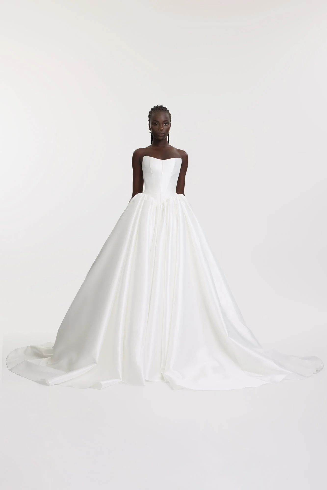 Dress like the queen that you are c/o KYHA Bride Miles. Crafted from a luxe woven taffeta, a gathered Basque waistline accentuates an hourglass shape made modern via a softly scooped neckline. Drama reigns supreme via the ballgown skirt, making Miles
