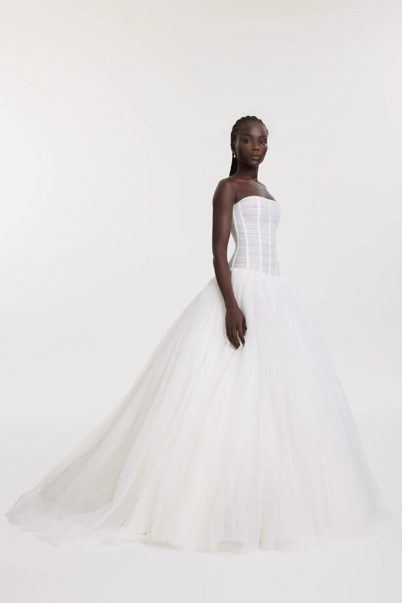 Balletcore energy en pointe via KYHA Bride Beau. Its structured, dropped waist bodice is artfully draped with soft tulle, but it’s the full, gathered skirt that delivers the kind of drama that is usually reserved for the stage