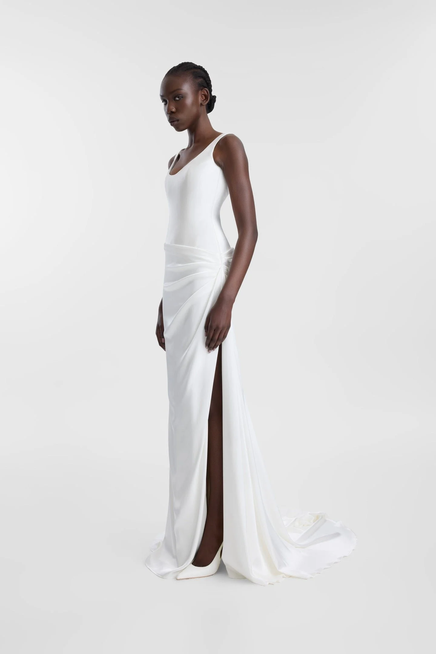 If there is a science to creating an it dress, KYHA Bride Estel has the formula. Crafted from luxe double satin, Estel features a scooped, smooth and structured bodice and skirt that is artfully wrapped across the body in a directional, asymmetric dr
