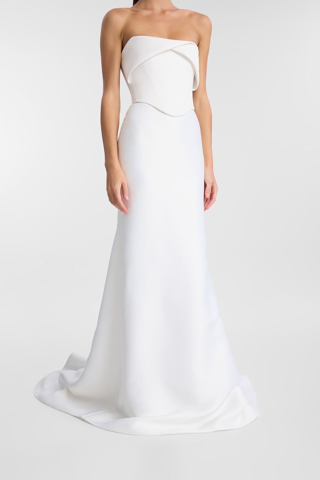 KYHA Bride Turner is a 101 in 90s minimalism and understated luxury. A fresh iteration of tradition, Turner is crafted from matte crepe with a high-waisted fit-and-flare skirt to accentuate the body. The waistband draws in the waist while the floor-s