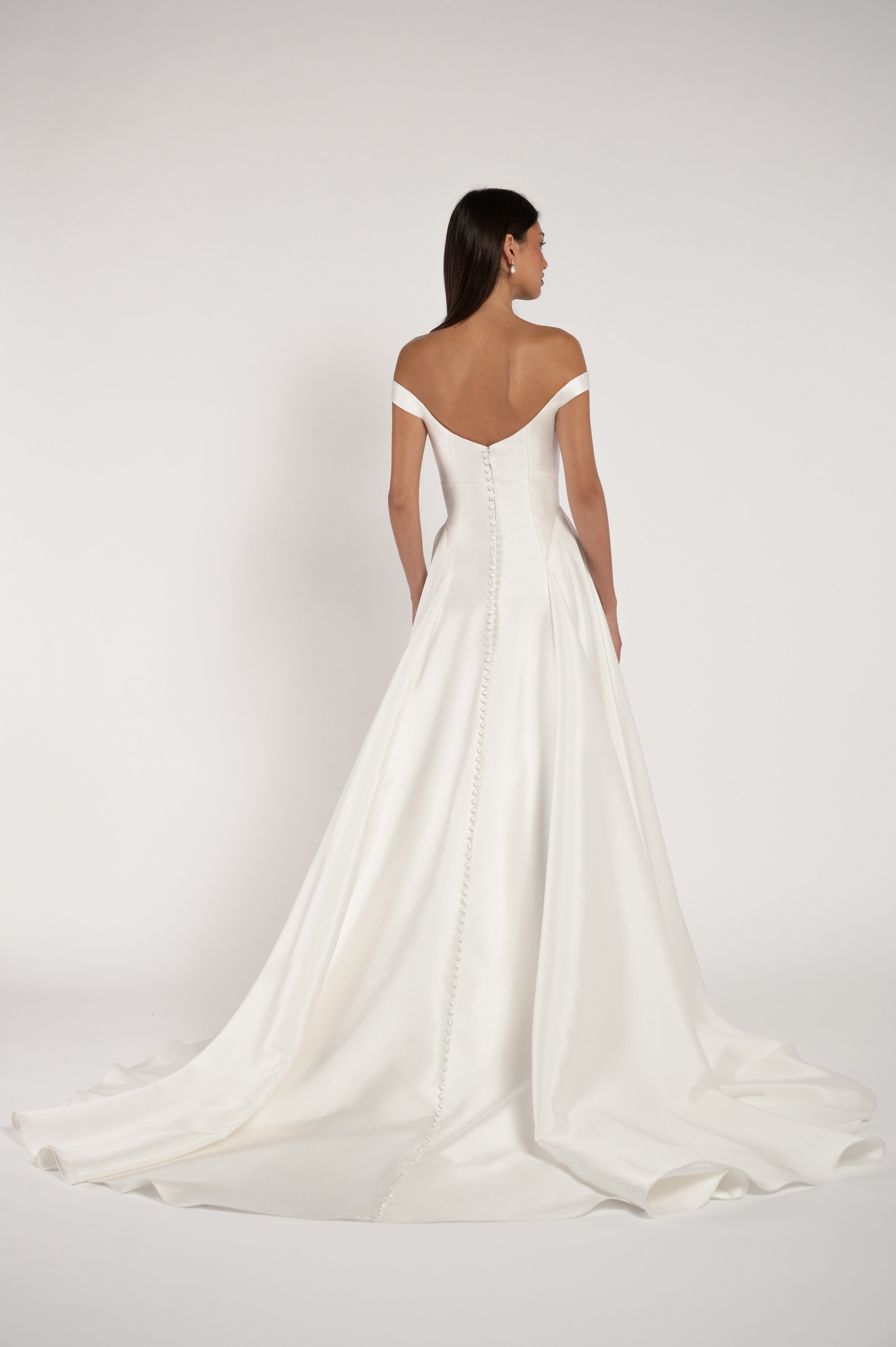 The Jenny Yoo Bridal Alyne gown is a classic beauty. The corseted bodice wraps gracefully around your shoulders while the dramatic skirt adds romance and drama. Available at Halo & Wren Bridal.

Details
Sleek Mikado fabric
Fully boned bodice
Bust cup