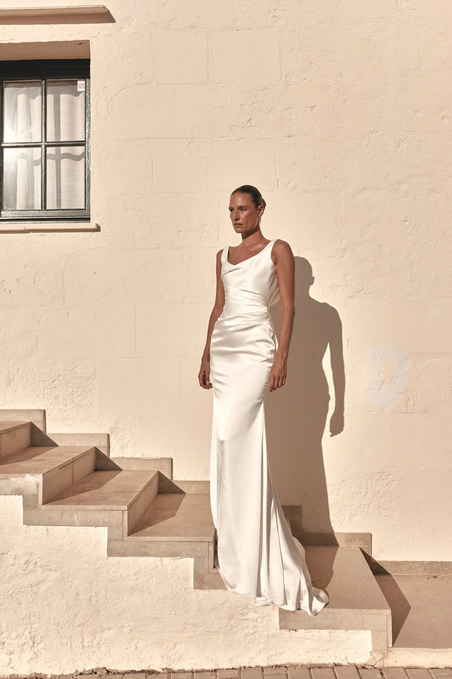 A love letter to 90s minimalism, KYHA Bride Llume is a structured take on a classic slip, Llume masters the art of draping, using organic folds across the scoop neckline, waist and hip, both bouncing light and accentuating the female form. Crafted fr