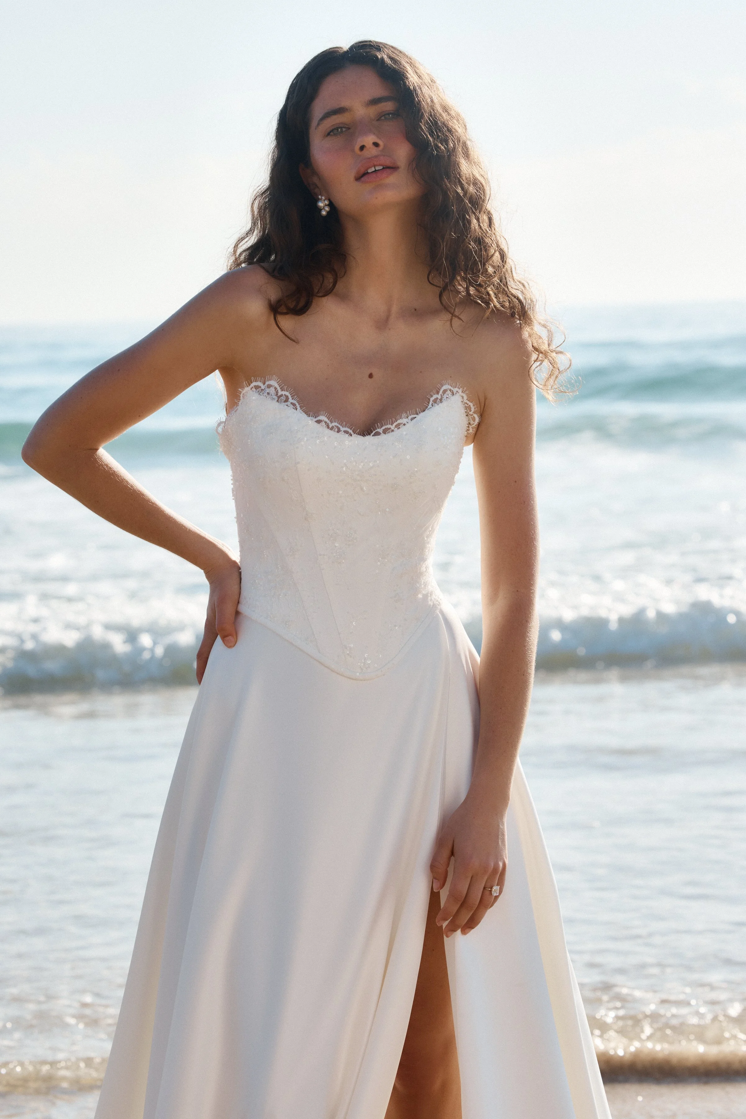 The MWL Landon is a stunning two piece dress, offering the elegance of a separate top and skirt for versatile styling. The top is crafted from delicate Blair lace and finished with the signature Blair trim, featuring the flattering Tate bodice shape.