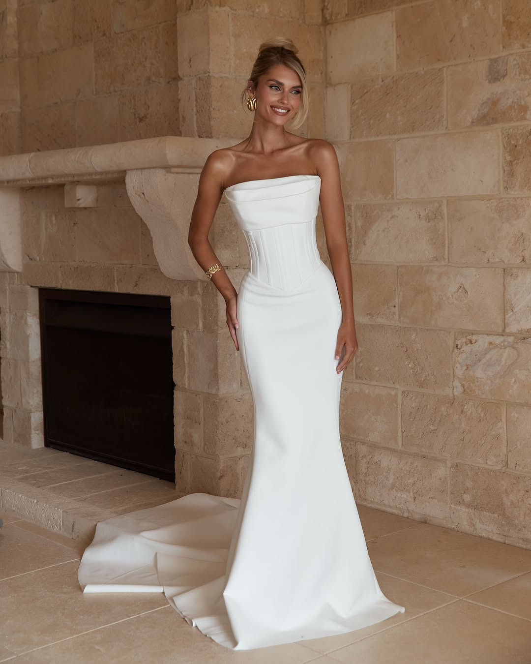 Jane Hill Bridal Benni sculpted for the modern bride, Benni features our signature fit-and-flare silhouette with a slight drop waist and a flattering straight neckline with bust detailing. this structured gown elongates the body while highlighting th