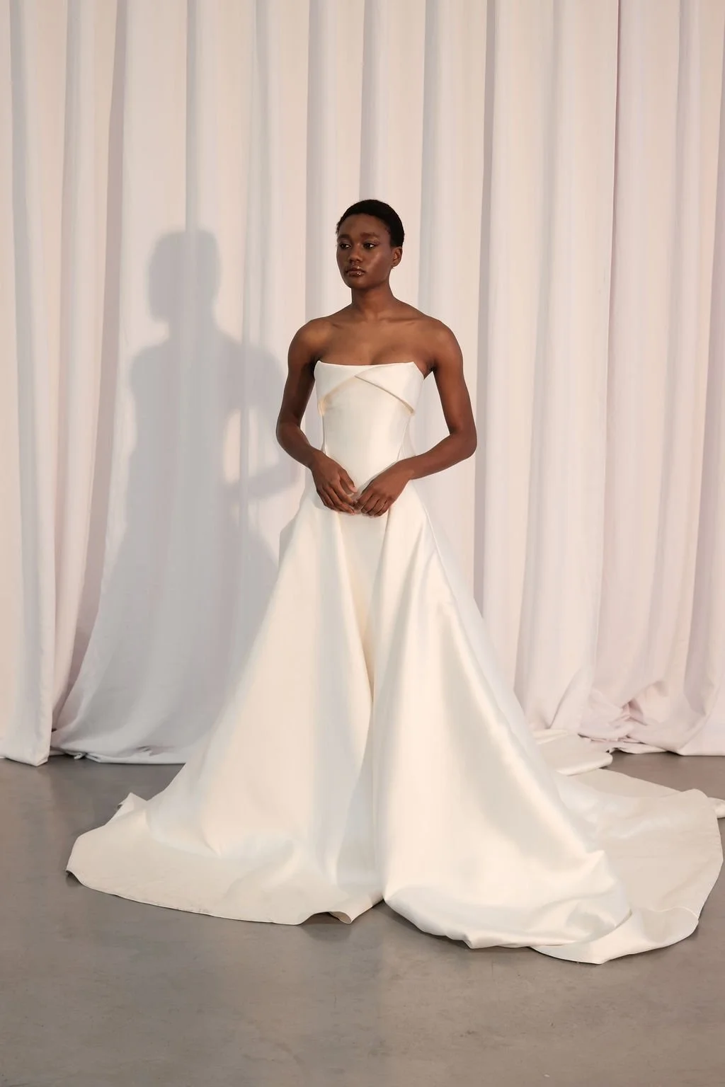 For a go-to for a modern, statement-making look, introducing KYHA Bride Lincoln. A striking silhouette with an unapologetic aesthetic, Lincoln balances technical precision with structural beauty. Cut from lustrous Mikado, Lincoln features a strapless