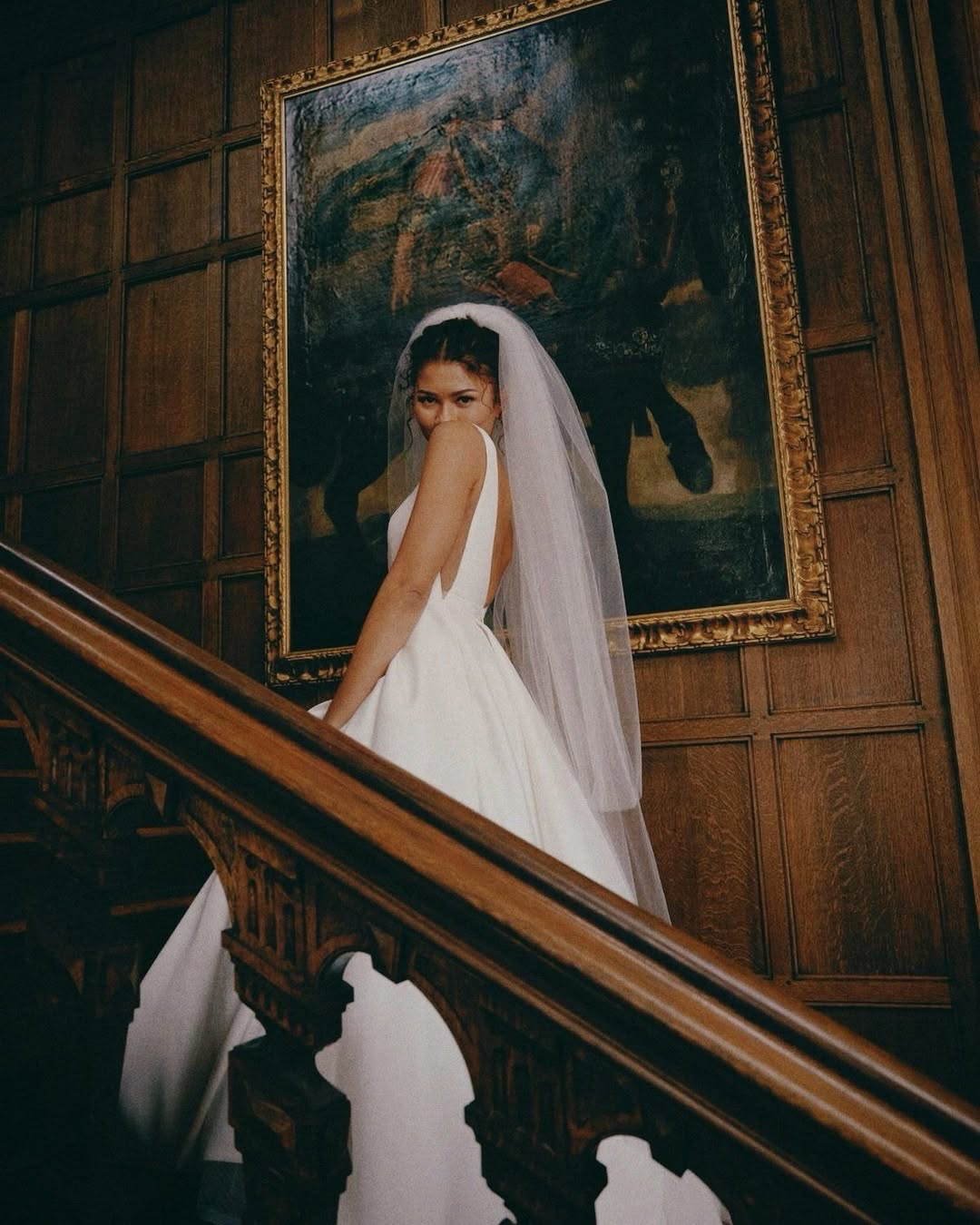 The Jenny Yoo Bridal Lawrence Gown stocked at Halo & Wren Bridal Ltd. The Lawrence scoop neck bridal gown blends an effortlessly cool feeling with classic bridal details. The squared off scoop neckline flatters the collarbone and décolletage, and the