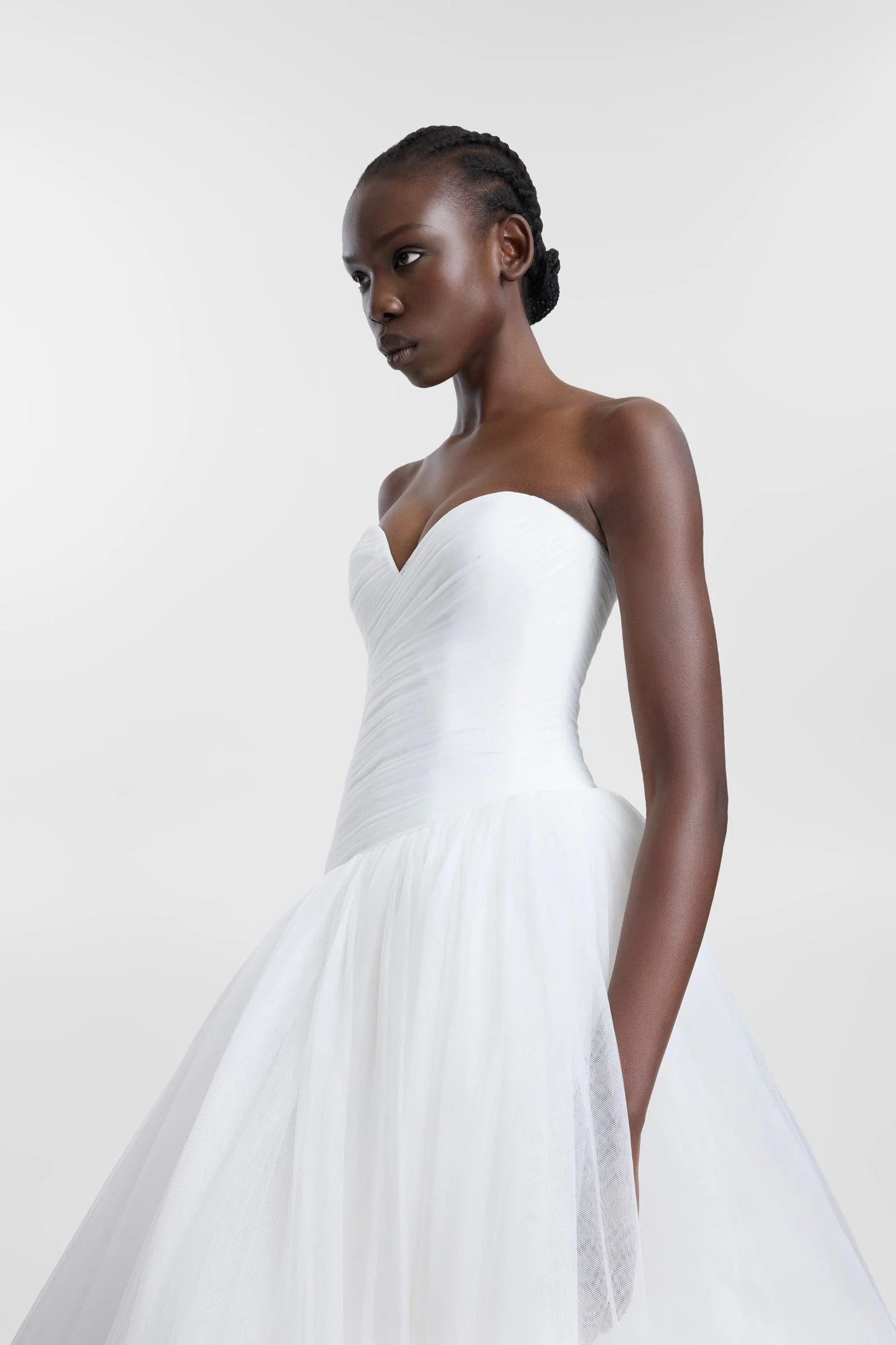 A lesson in soft layering via Pippi. Celebrating the female form in swathes of ivory tulle, Pippi delivers high impact thanks to its striking ballgown silhouette, sweetheart neckline and textured draping at the waistline. Rewriting the bridal codes o
