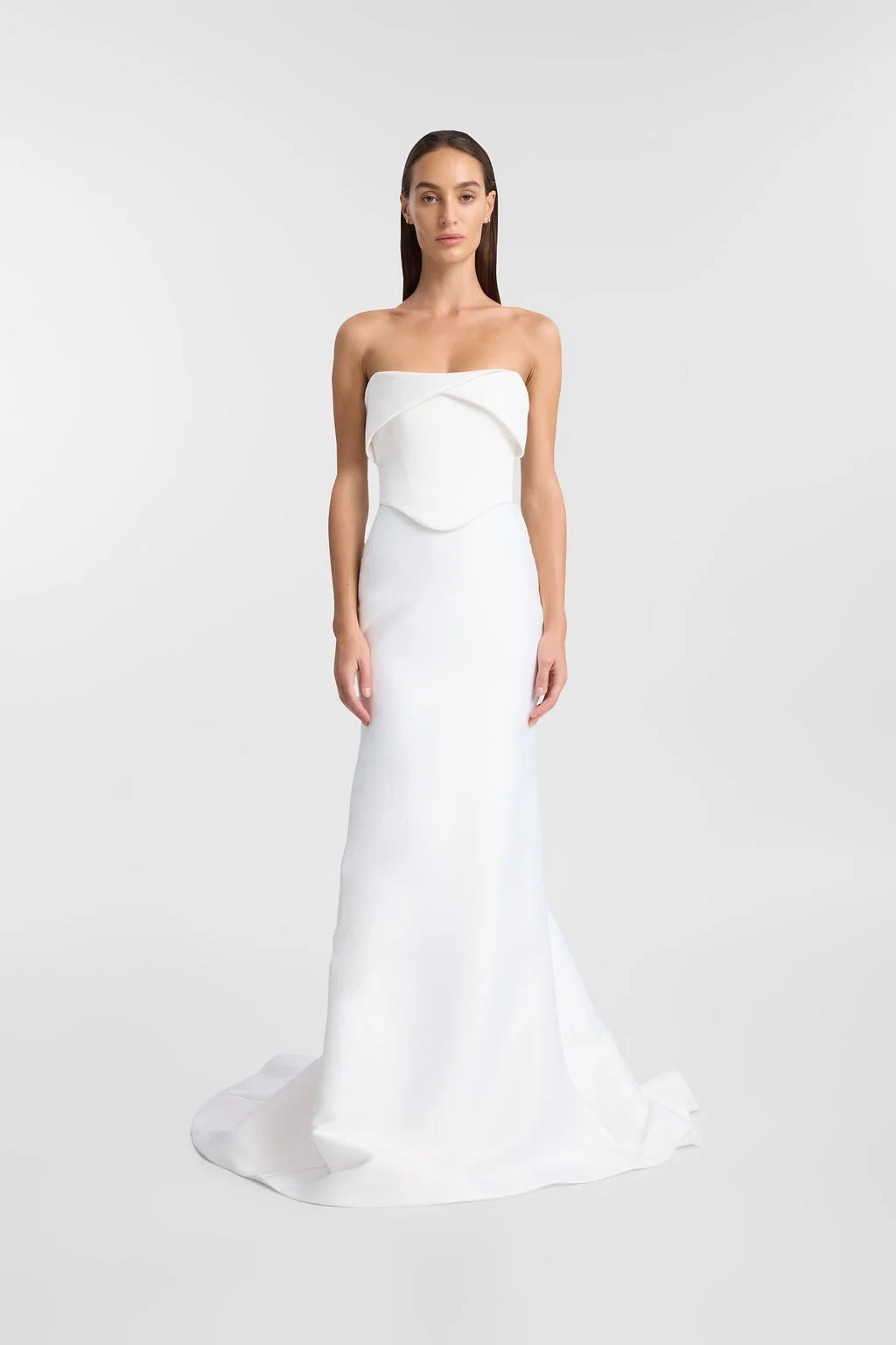 KYHA Bride Turner is a 101 in 90s minimalism and understated luxury. A fresh iteration of tradition, Turner is crafted from matte crepe with a high-waisted fit-and-flare skirt to accentuate the body. The waistband draws in the waist while the floor-s