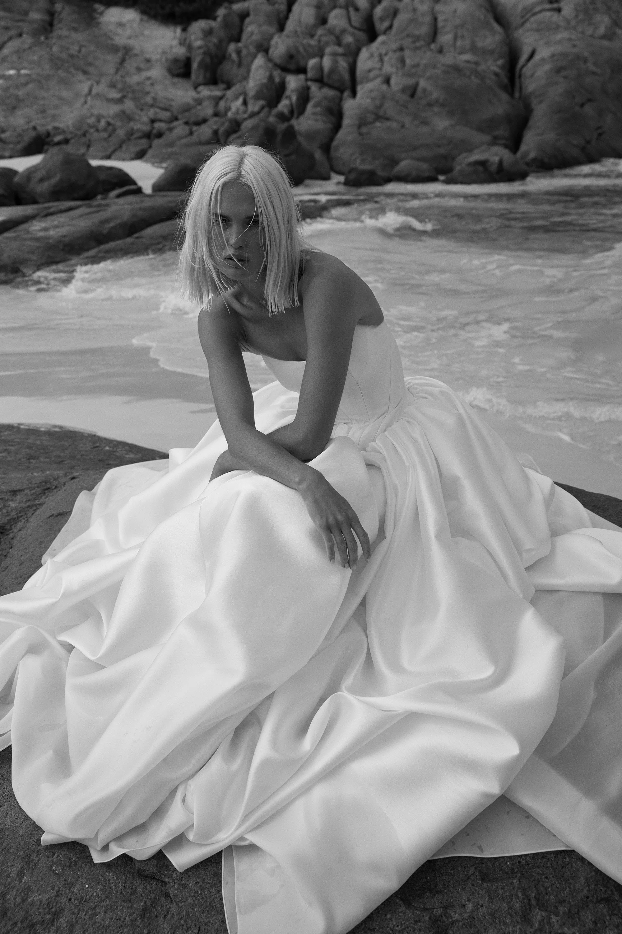 Dress like the queen that you are c/o KYHA Bride Miles. Crafted from a luxe woven taffeta, a gathered Basque waistline accentuates an hourglass shape made modern via a softly scooped neckline. Drama reigns supreme via the ballgown skirt, making Miles