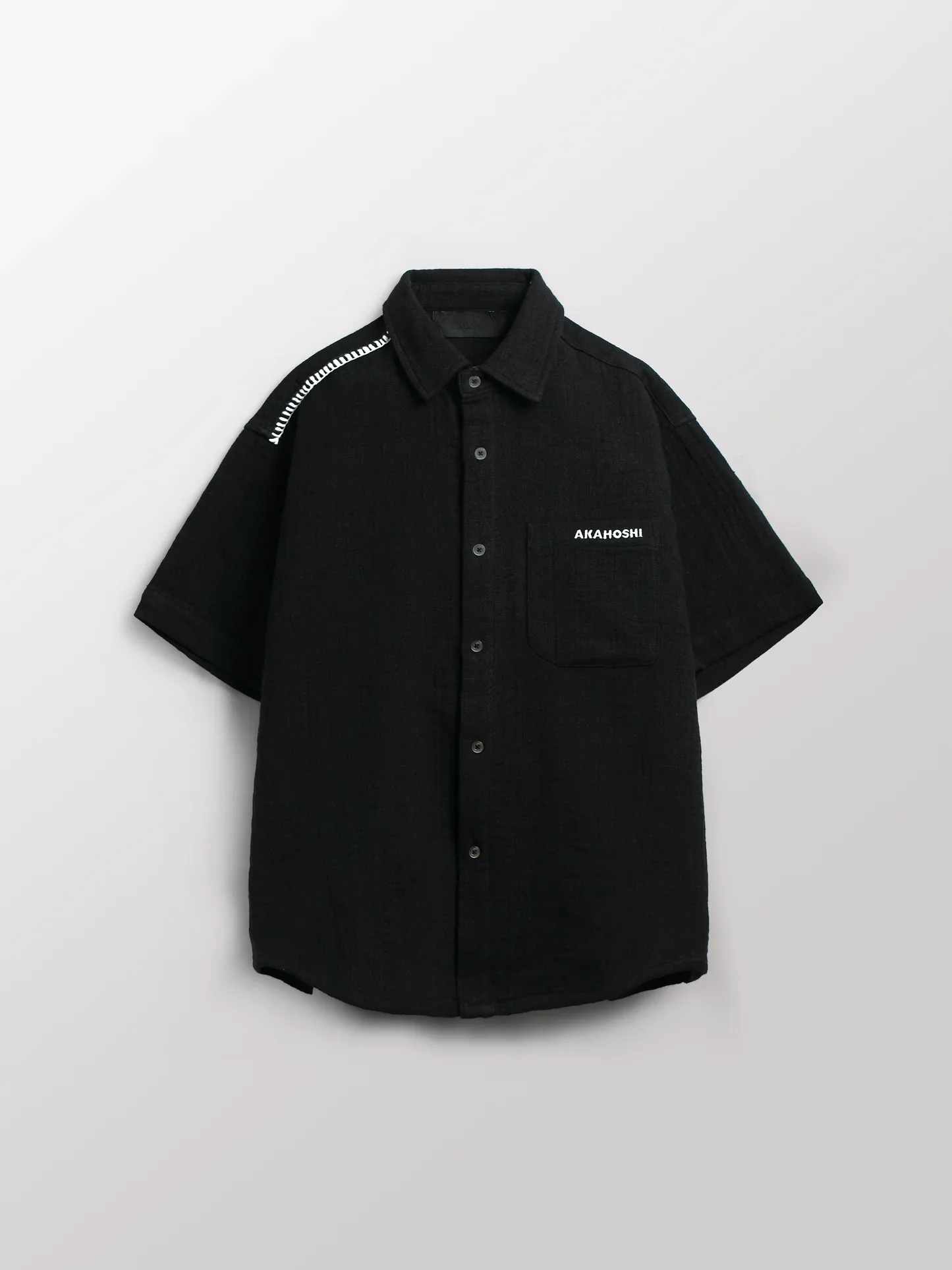 Akahoshi x Hidden Characters Work Shirt
Smock style button up designed with kitchen heat resistance and freedom of movement in mind. Textured linen with a rugged hand feel. Black colorway. 
$98
