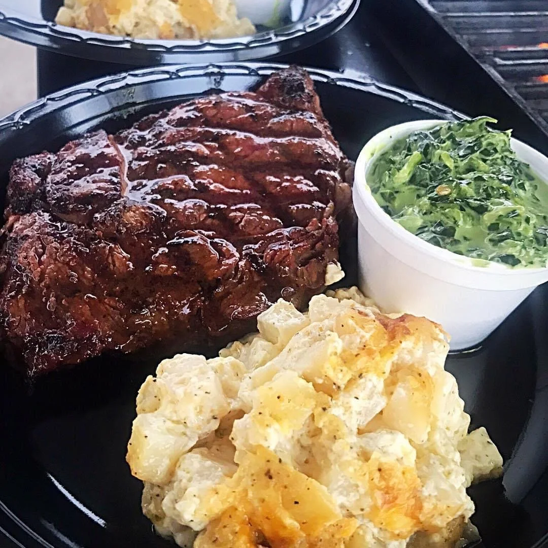 Grilled ribeye steak, creamy potato casserole and rich, buttery creamed spinach catered by Southern Standard.