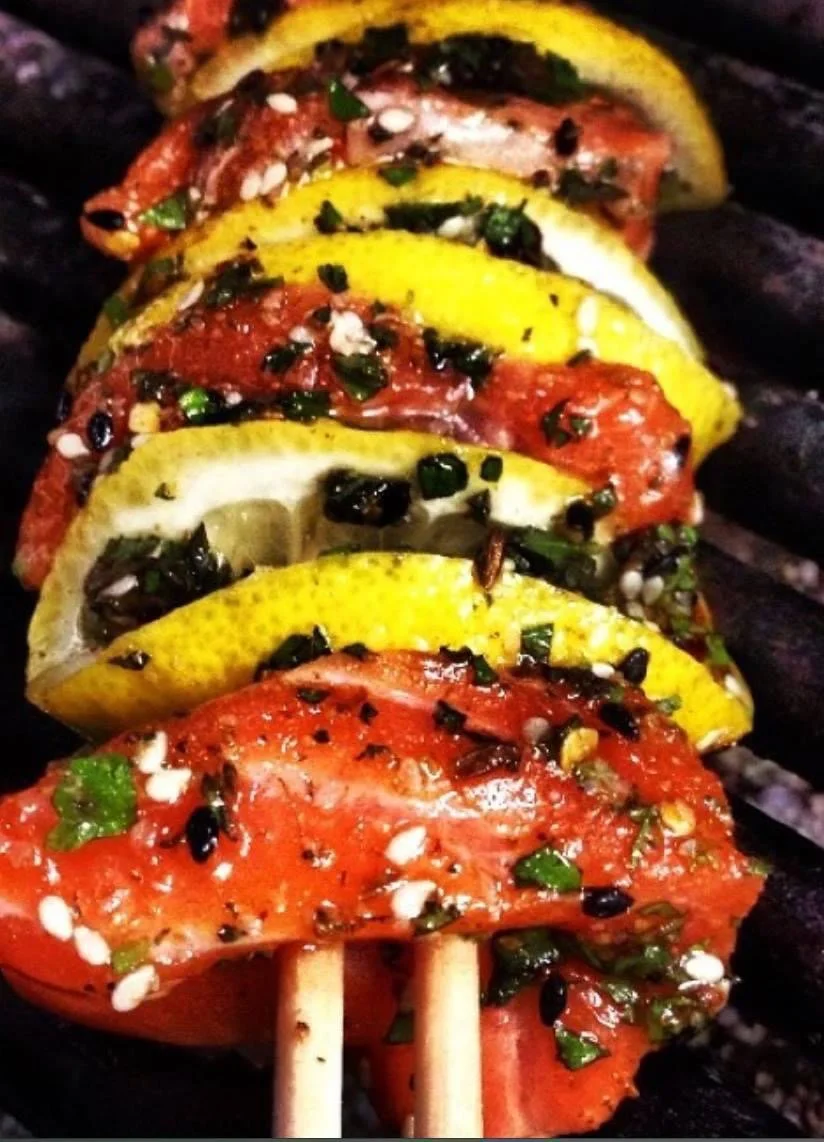 Grilled and seasoned vegetables on skewers prepared by Southern Standard.