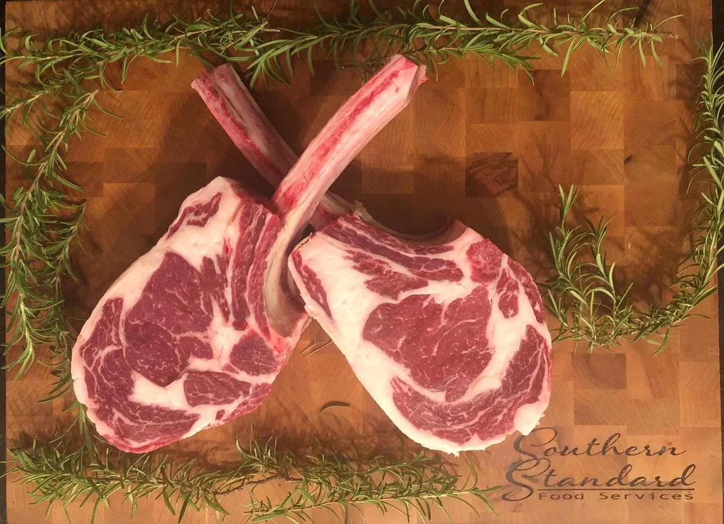 Fresh Tomahawk steak ready for grilling by Southern Standard Events and Catering.
