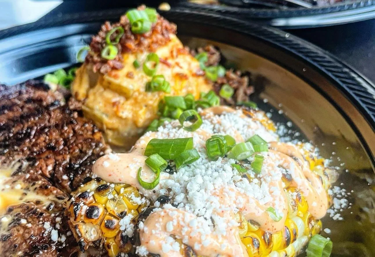 Steak, roasted corn on the cob and loaded mashed potatoes catered by Southern Standard in Houston, TX