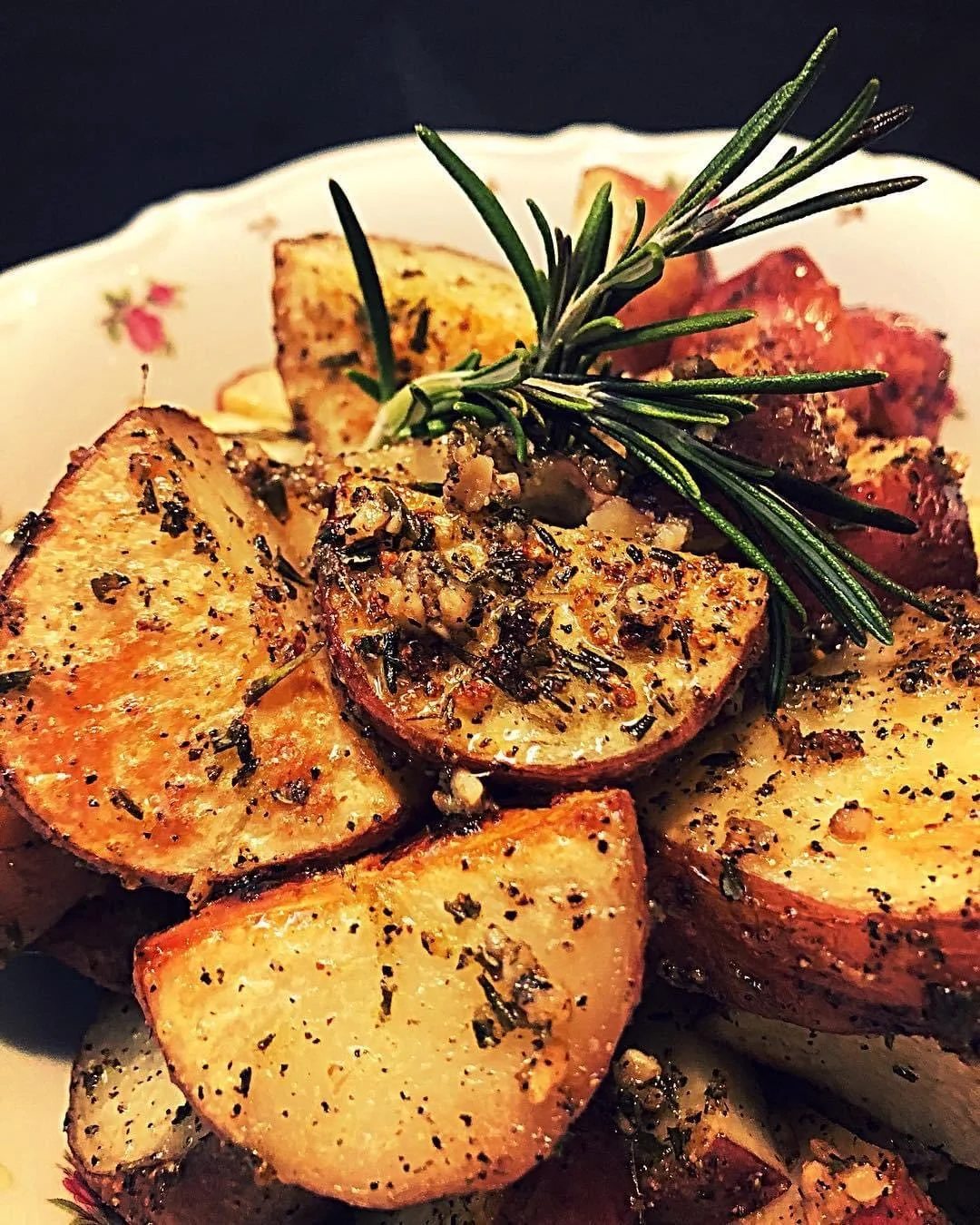 Herb-Roasted Potatoes with Rosemary Garnish by Southern Standard.