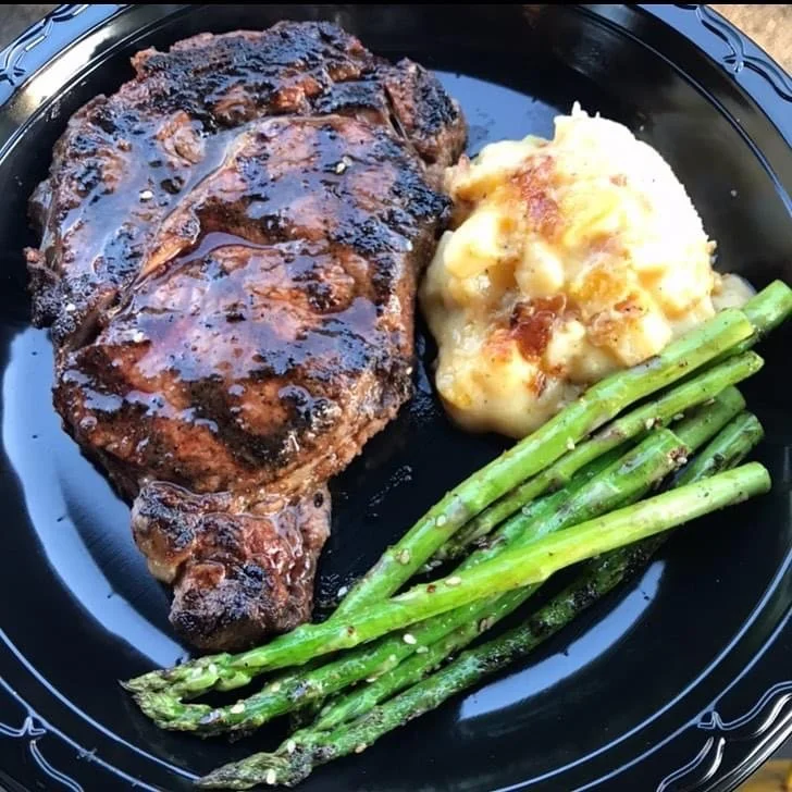 Dinner plate with Steak, mashed potatoes and asparagus made fresh in Houston, TX.