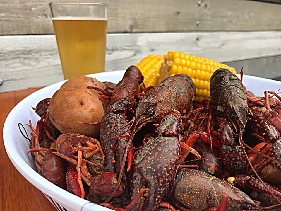 Outdoor crawfish broil at private event catered by Southern Standard in Houston.