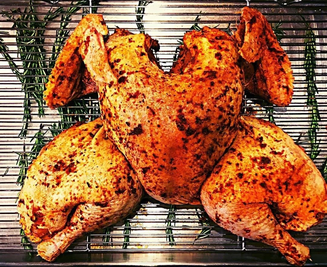 Herb smothered chicken with rosemary prepared by Southern Standard Events and Catering