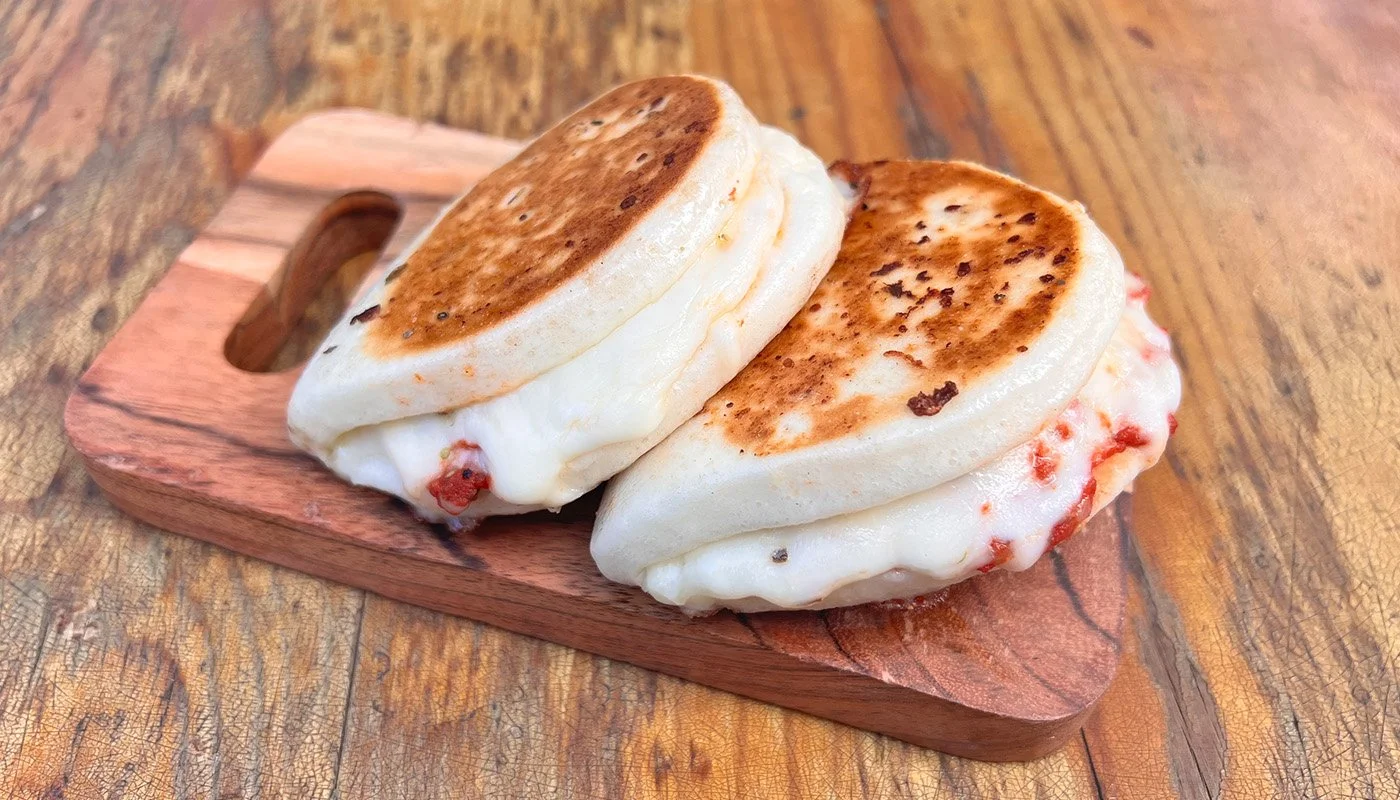 Bao'zza Melt - Cheese 
 
Italian-style. Steamed bao filled with marinara, a mozzarella cheese blend with provolone & white cheddar, brushed with a parmesan garlic herb butter, then grilled to melted & toasty perfection.