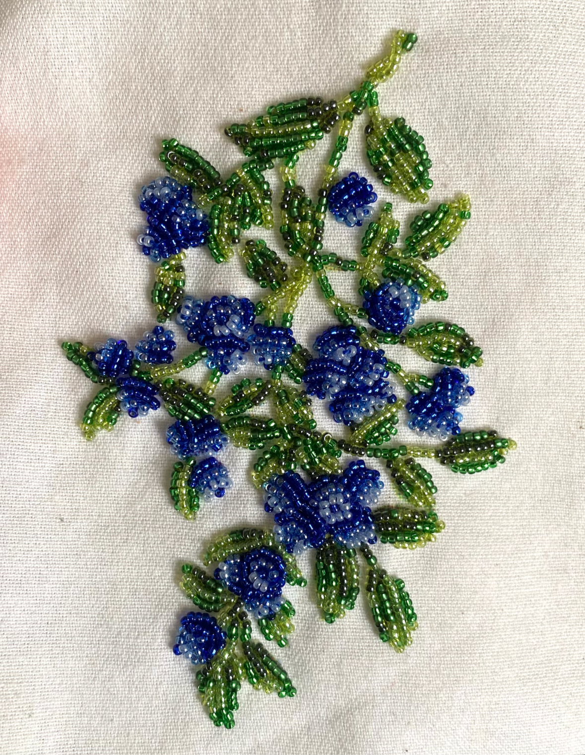 "Blueberry" 
Hand beaded on printed canvas tote bag, 2024