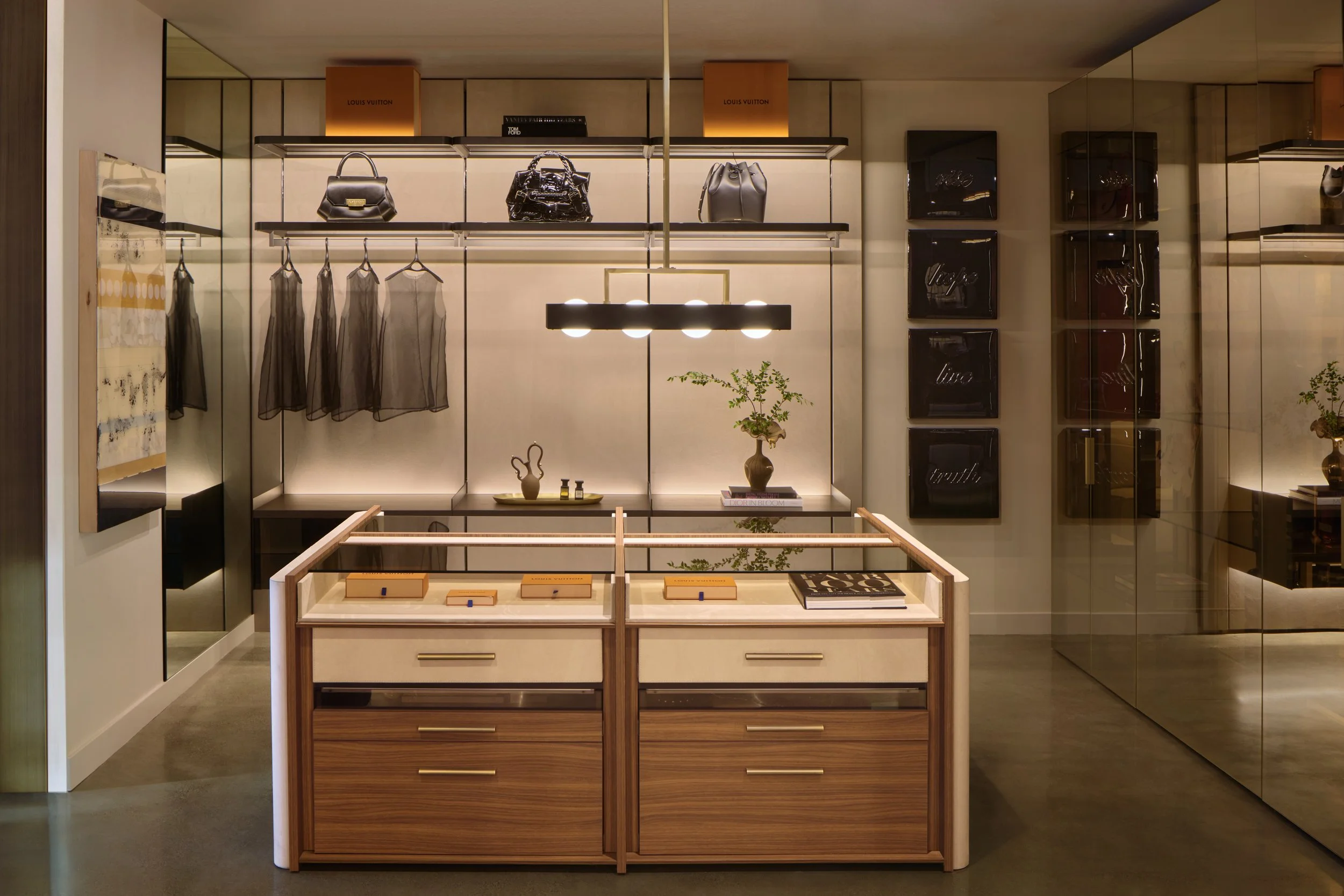 Open wardrobe system with electrified rail shelving, Alcantara back wall, and illuminated glass shelves — SCIC Night Collection, San Francisco showroom