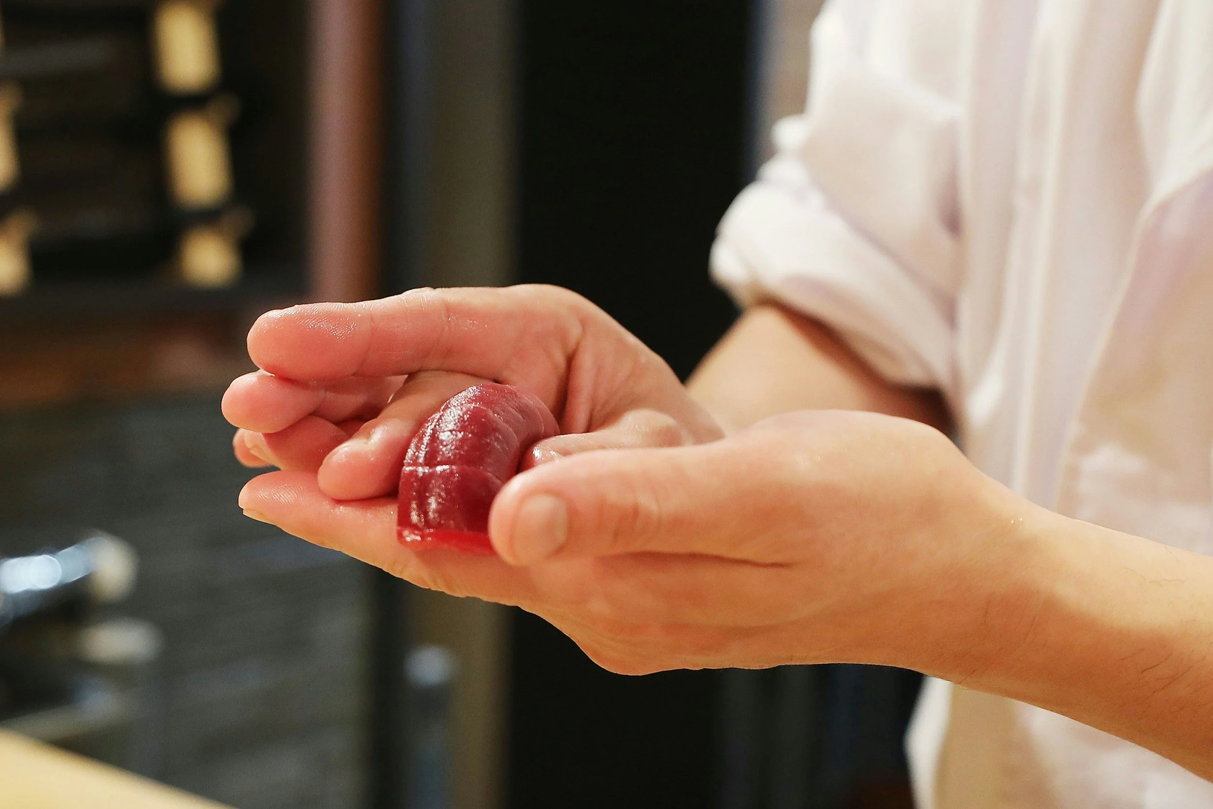 sushi being prepared by a sushi chef