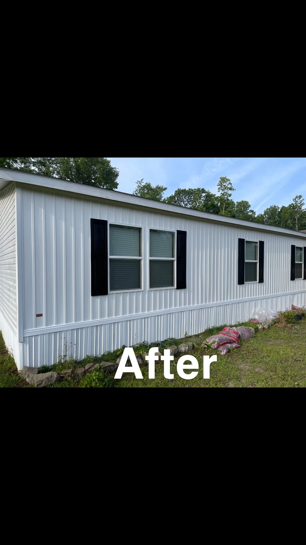 Photo of the side of a white metal building with four windows and black shutters, with the word 'After' overlayed in white text at the bottom.