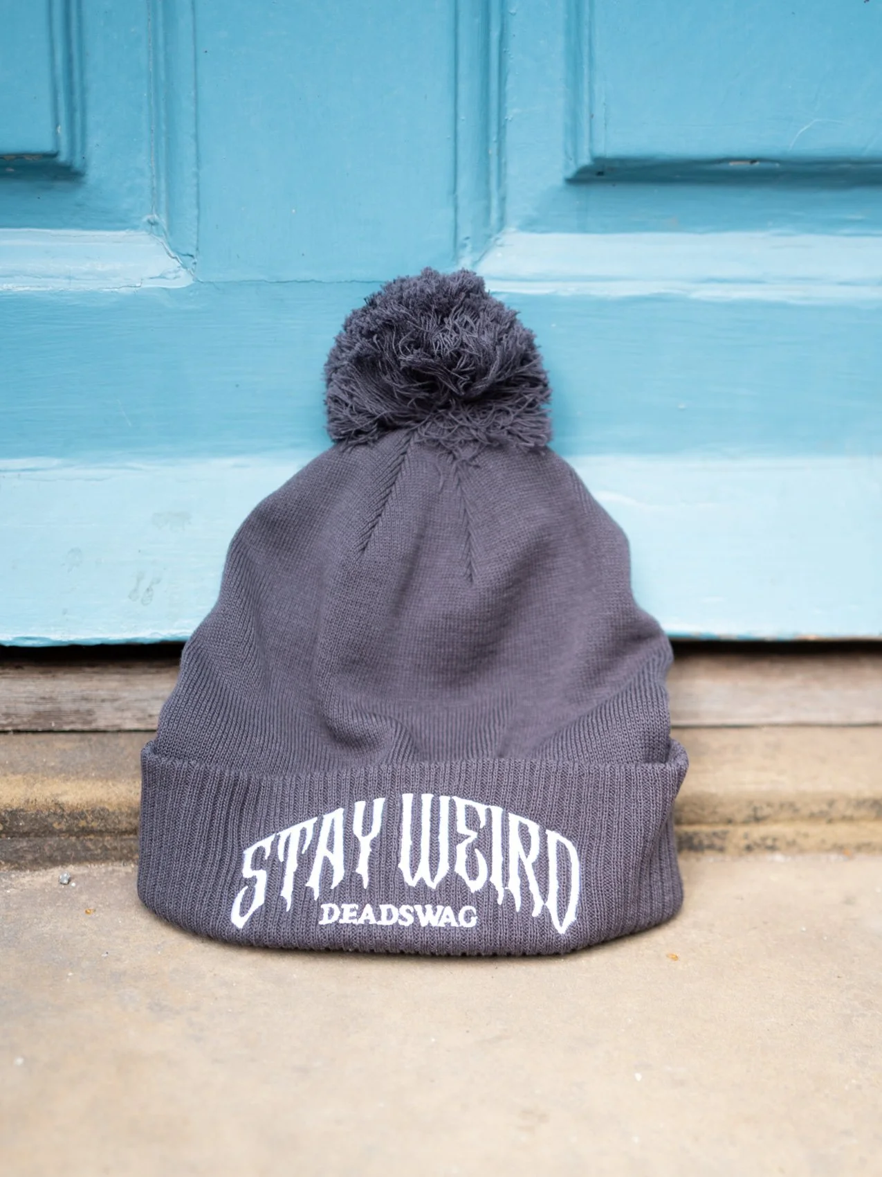 STAY WEIRD BOBBLE HAT - GREY
