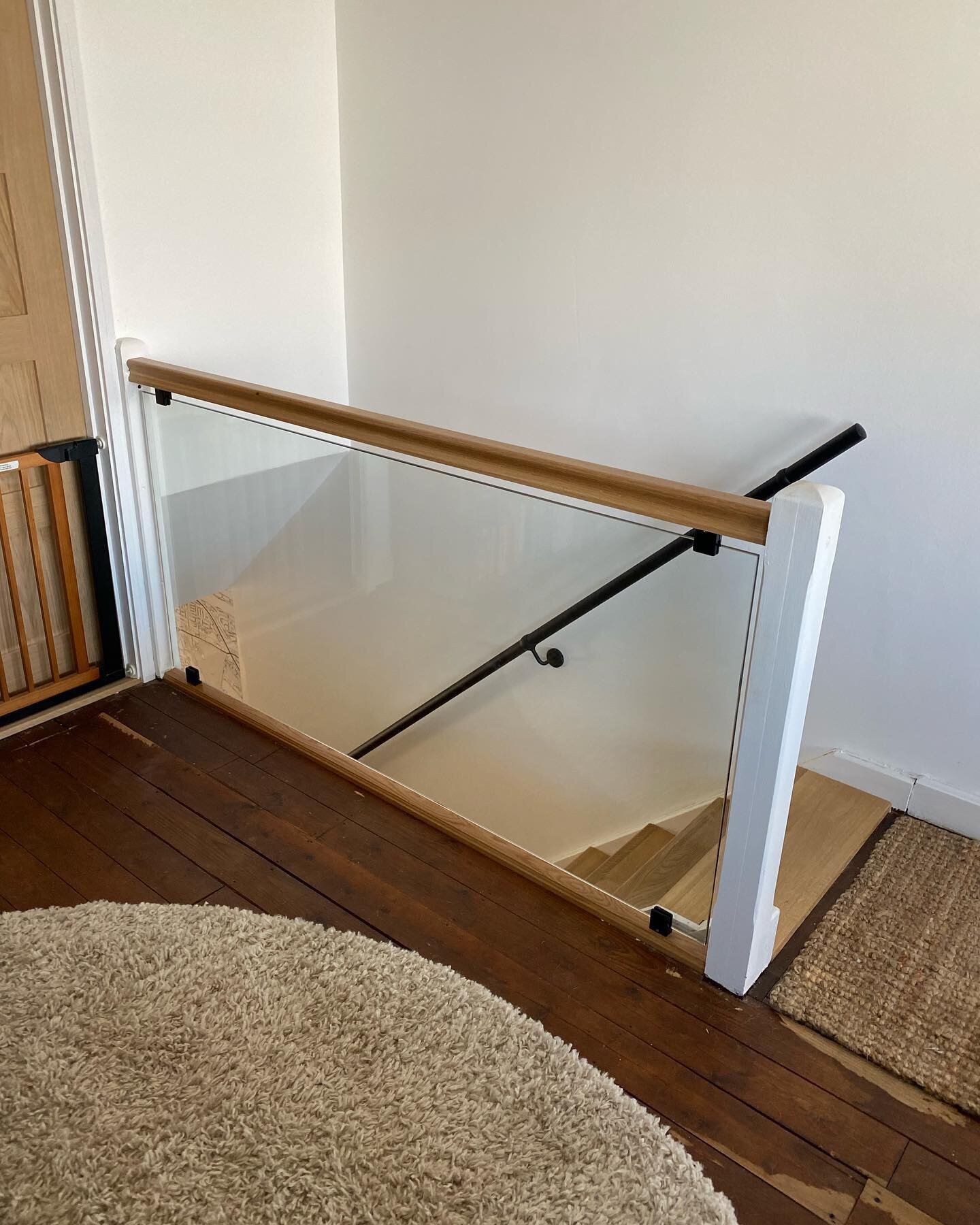 New oak treads and risers fitted over existing stairs. Oak handrail and glass supplied and fitted.