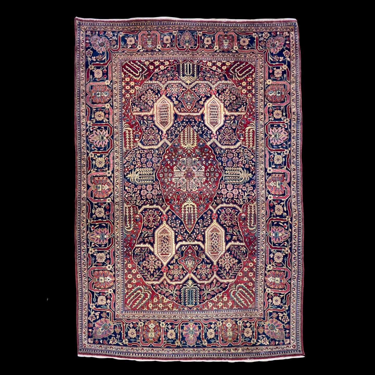 From the storied looms of central Iran, this antique Kashan rug comes as a pair and weaves a narrative of craftsmanship into every knot. 
Created in the 1920s-30s, it boasts a vibrant tapestry of deep reds, blues, and ivories, with a central eight-po