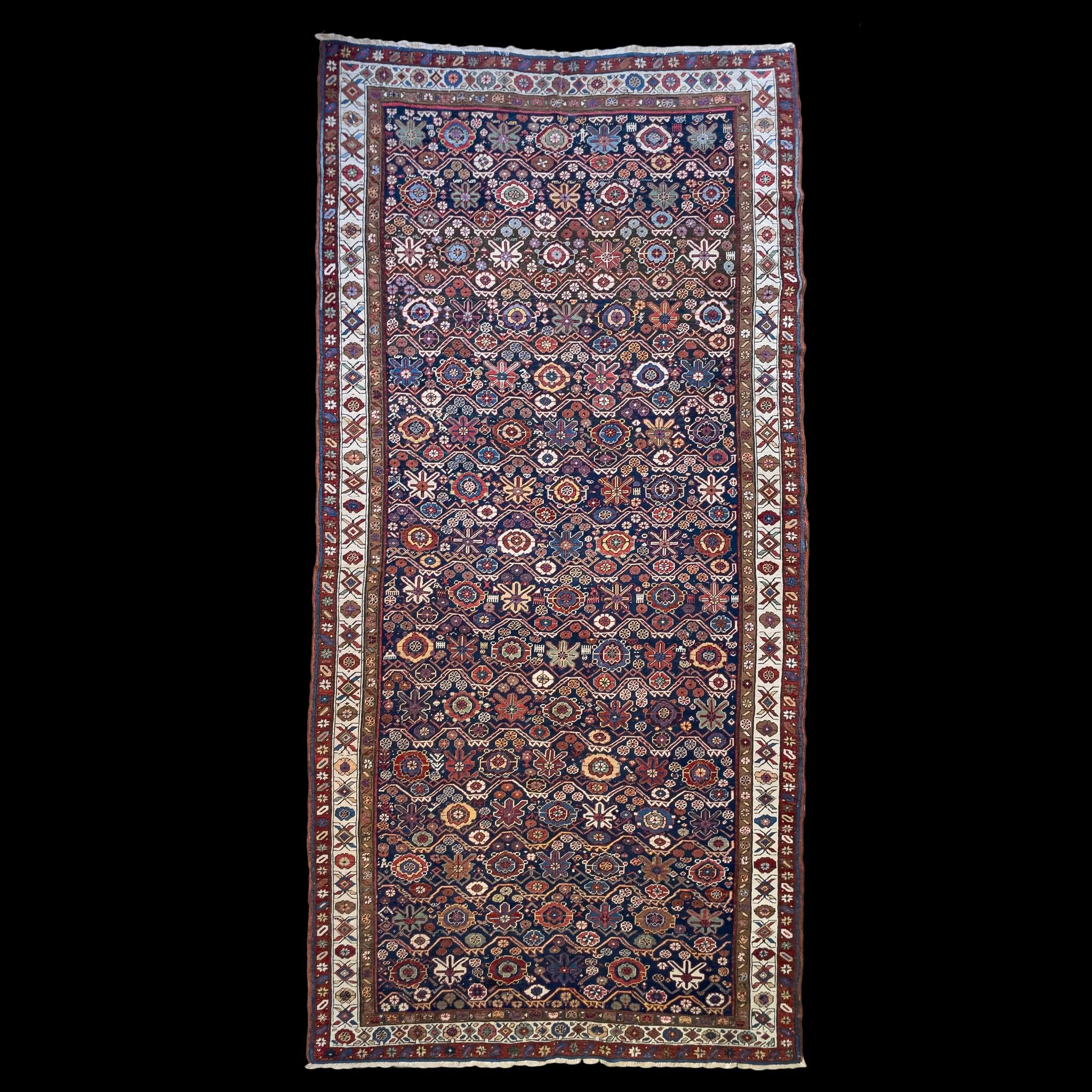 Discover our 1890s Ferahan Sarouk rug, a testament to Persian artistry from the Ferahan region. 

This masterpiece, celebrated for its exquisite wool, sophisticated palette, and harmonious blend of geometric and curvilinear designs, is a rare gem tha
