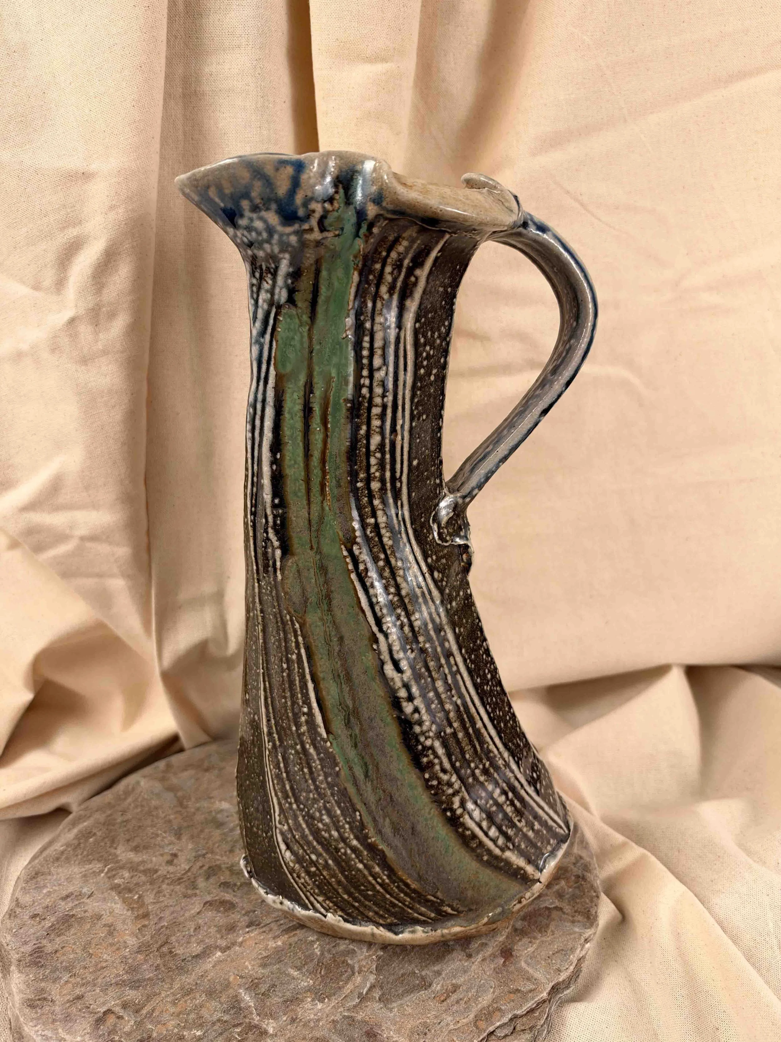 Ruthanne Tudball - Soda glazed green faceted pitcher.jpg