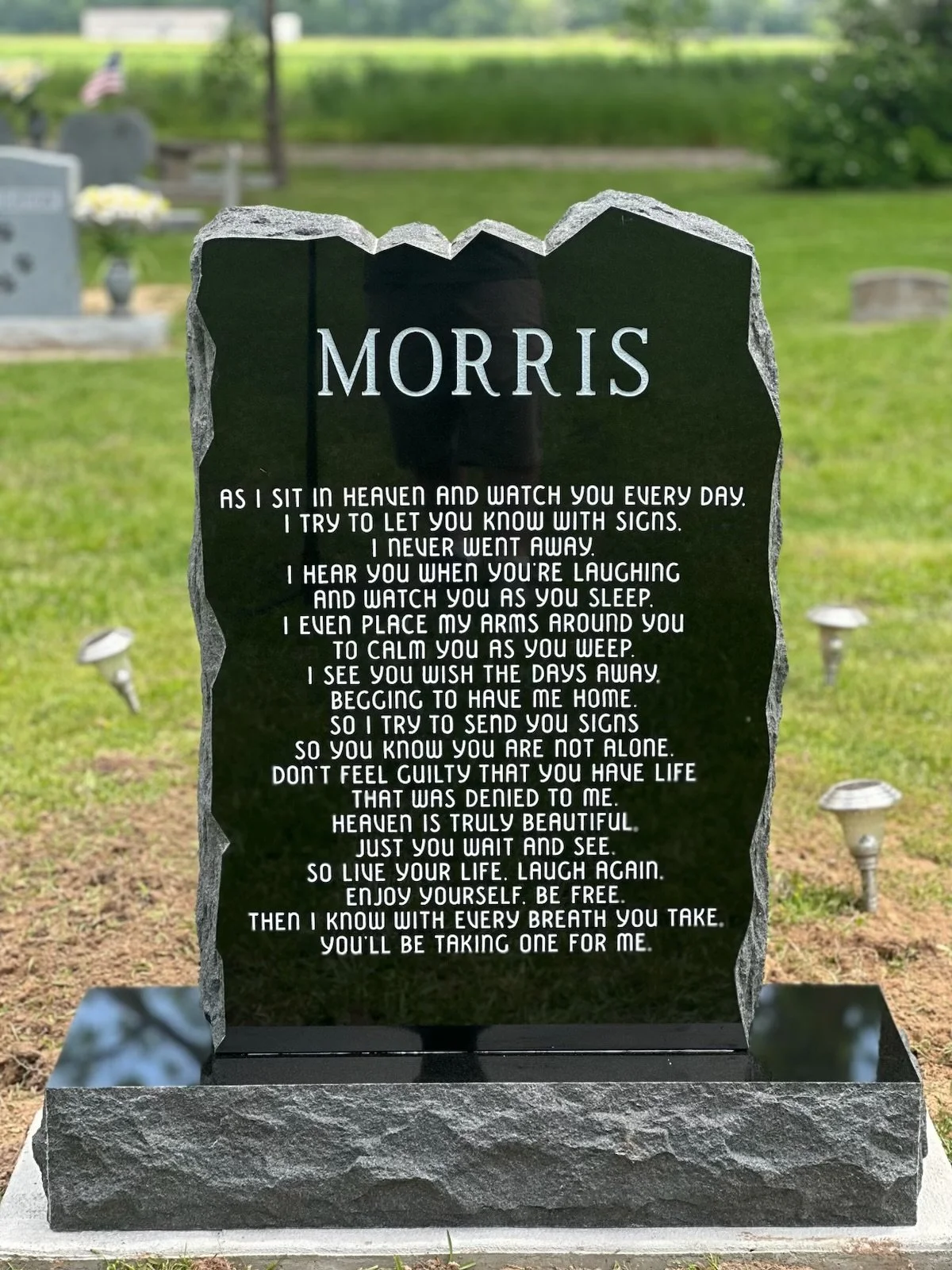 Gravestone with the surname MORRIS and a heartfelt poem honoring a loved one in a cemetery.