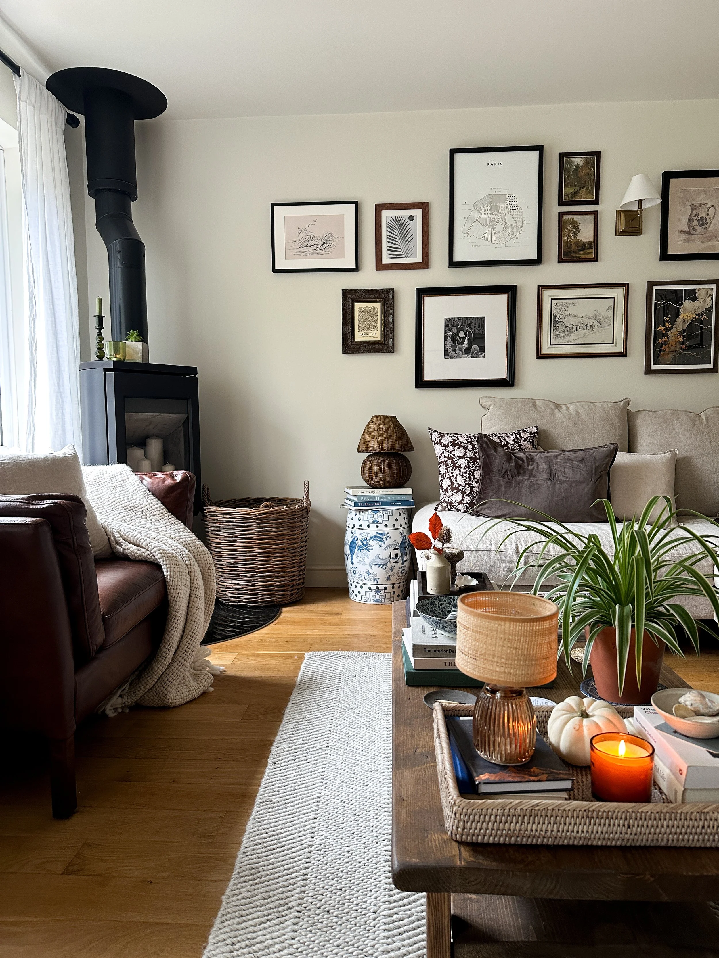 brown leather cosy reading chair next to woodburner