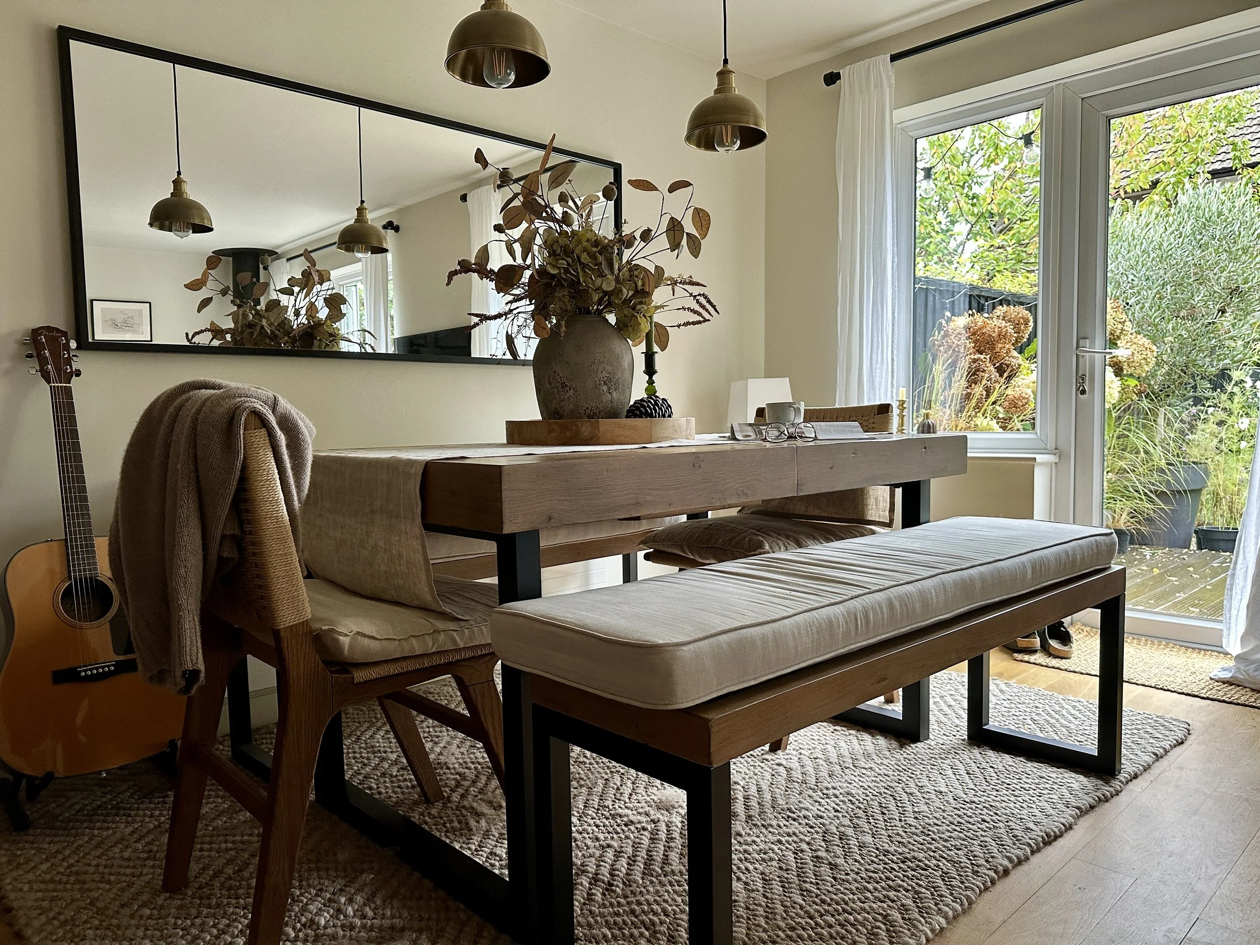cosy dining table with benches and autumn foiliage